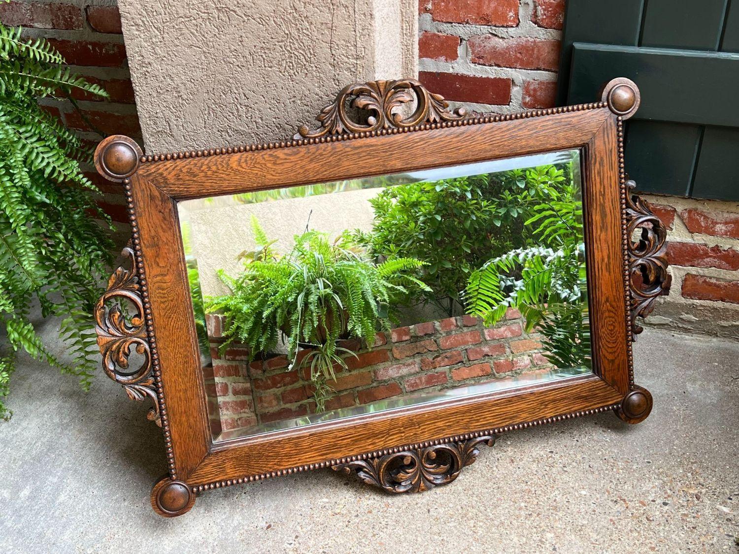 British Antique English Beveled Wall Mirror Carved Oak Frame Jacobean Arts & Crafts For Sale