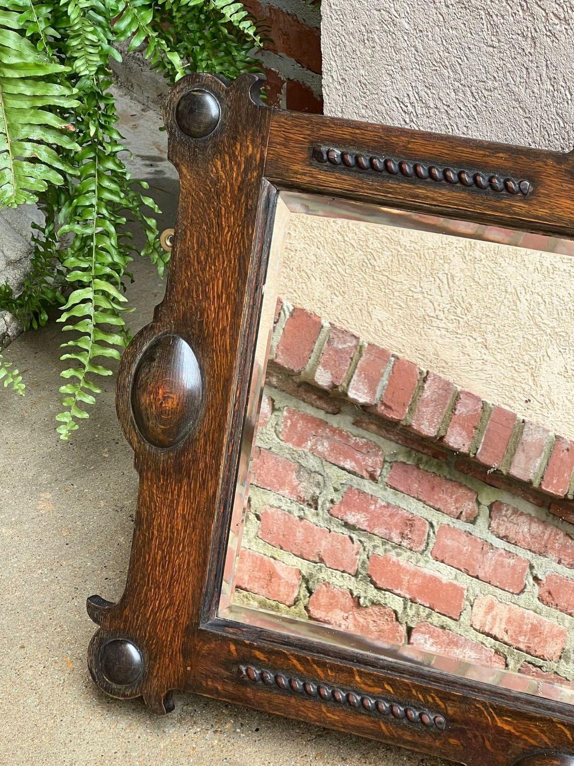 Early 20th Century Antique English Beveled Wall Mirror Carved Oak Frame Jacobean Arts & Crafts