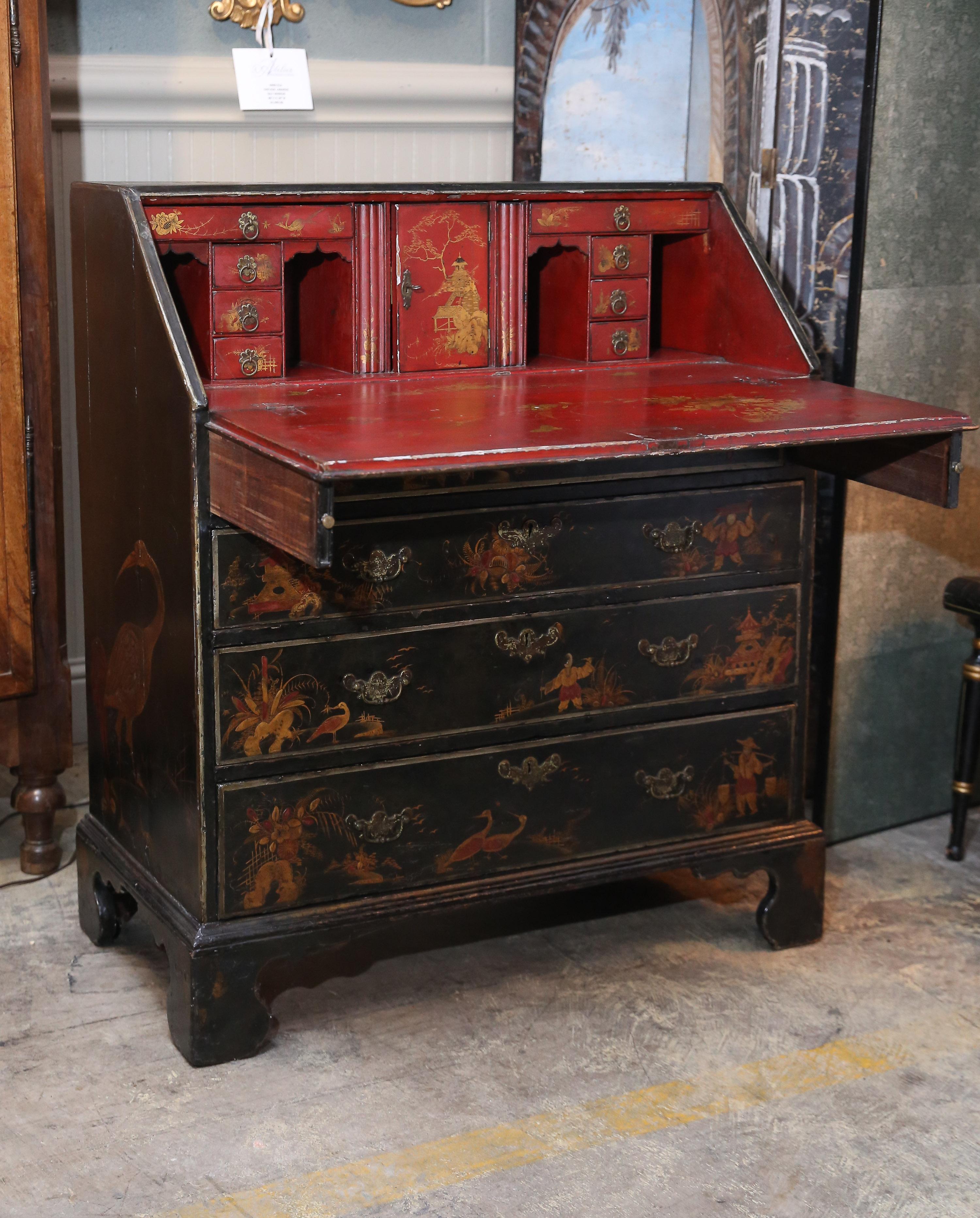 Chinoiserie English Black Slant desk is painted with gold decoration with accents of red.
Beneath Desk top there are four working drawers on Asian-style legs.
Red interior of desk is also painted with gold decoration.



  