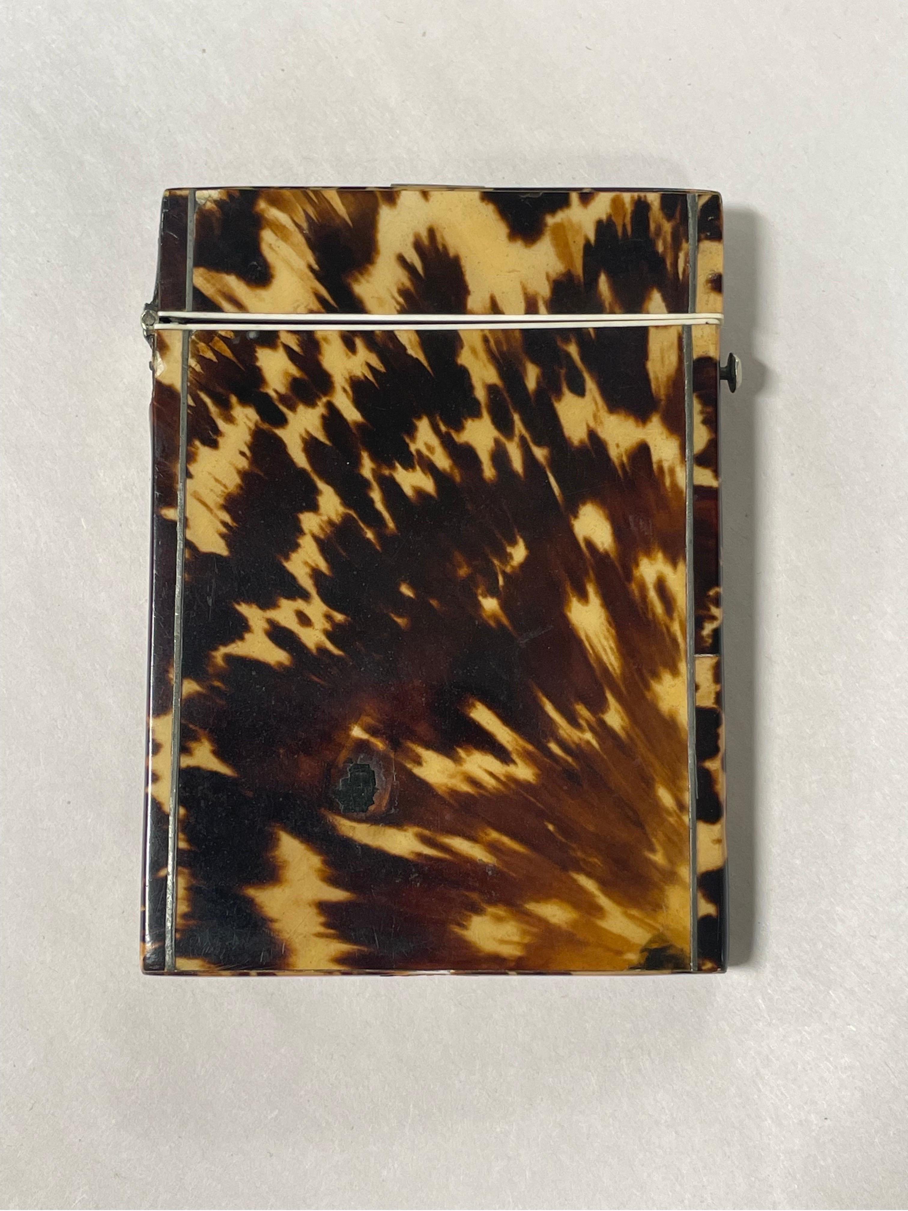 An Antique English blonde tortoiseshell card holder with locking hinge. 
Please view all photographs for damage.