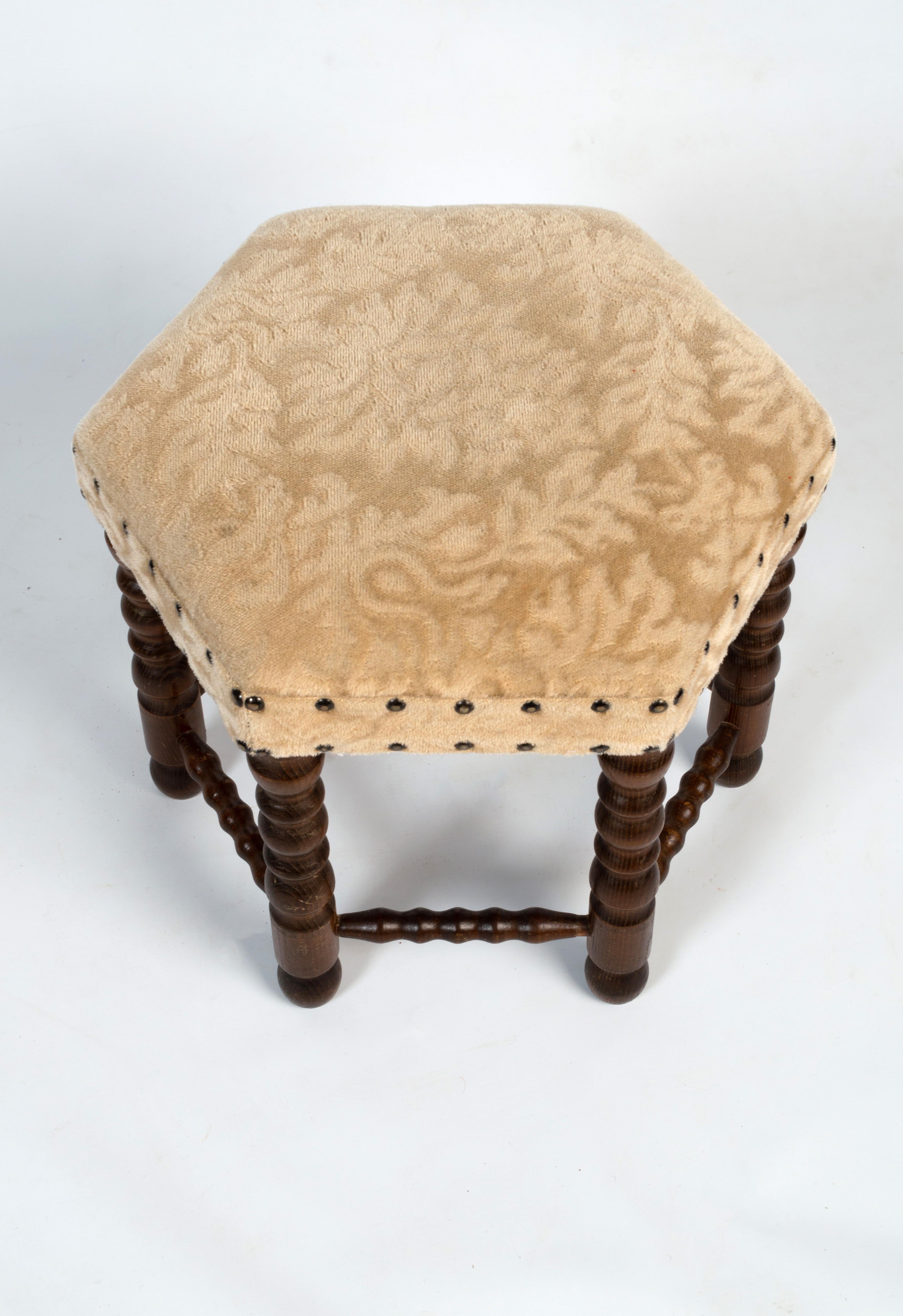 Antique English Bobbin Turned Hexagonal Upholstered Stool Ottoman circa 1920.

In good condition commensurate of age.