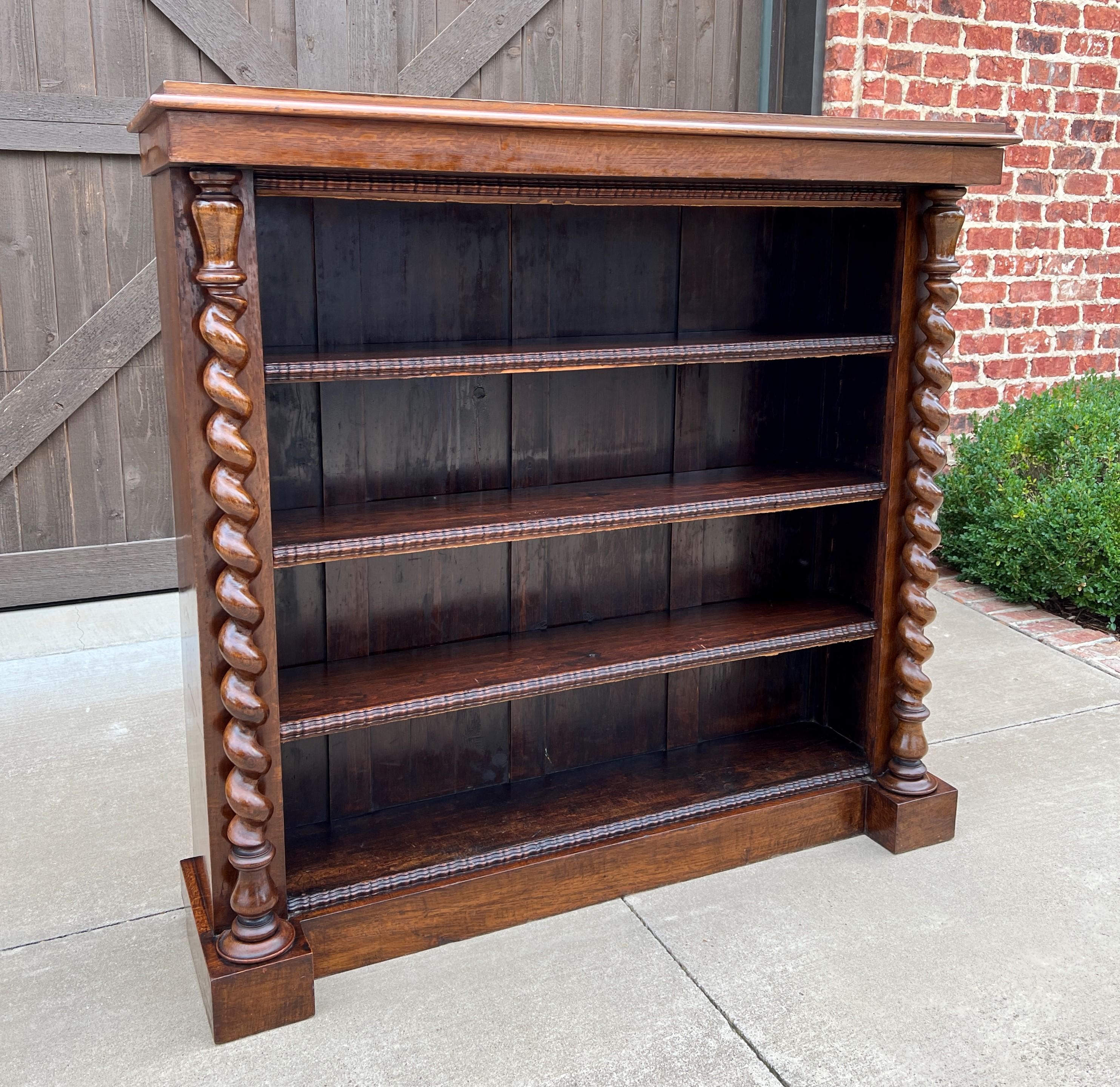 Beautiful antique English oak barley twist bookcase or display shelf/cabinet ~~c. 1920s.

Perfect for displaying your favorite antique books or collectibles~~top surface above shelves is flat for additional display.

Barley twist posts with