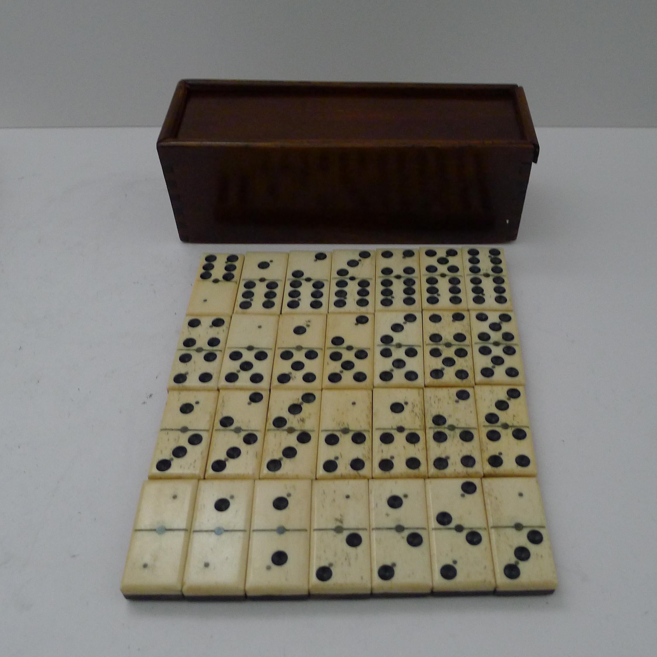 Early 20th Century Antique English Boxed Bone & Ebony Wood Dominoes For Sale