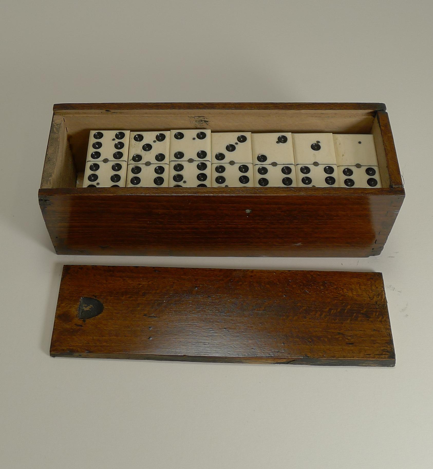 Early 20th Century Antique English Boxed Set Bone and Ebony Wood Dominoes, circa 1900