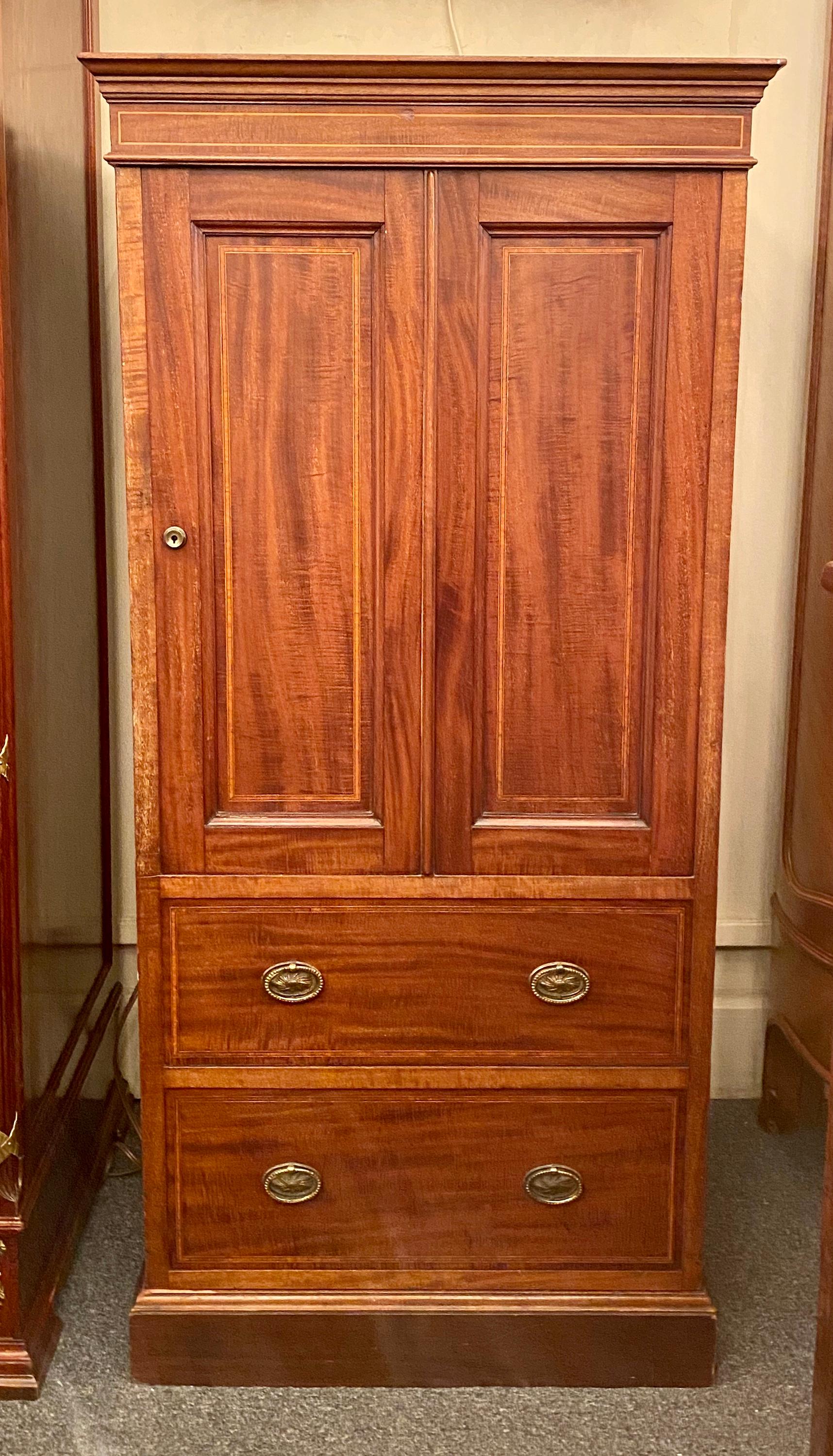 Antique English Bramah mahogany collector's cabinet with hidden safe, circa 1880.
The iron safe has a brass handle and lock plate and is marked 