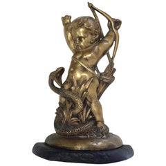 Antique English Brass and Iron Cupid with Serpent Doorstop