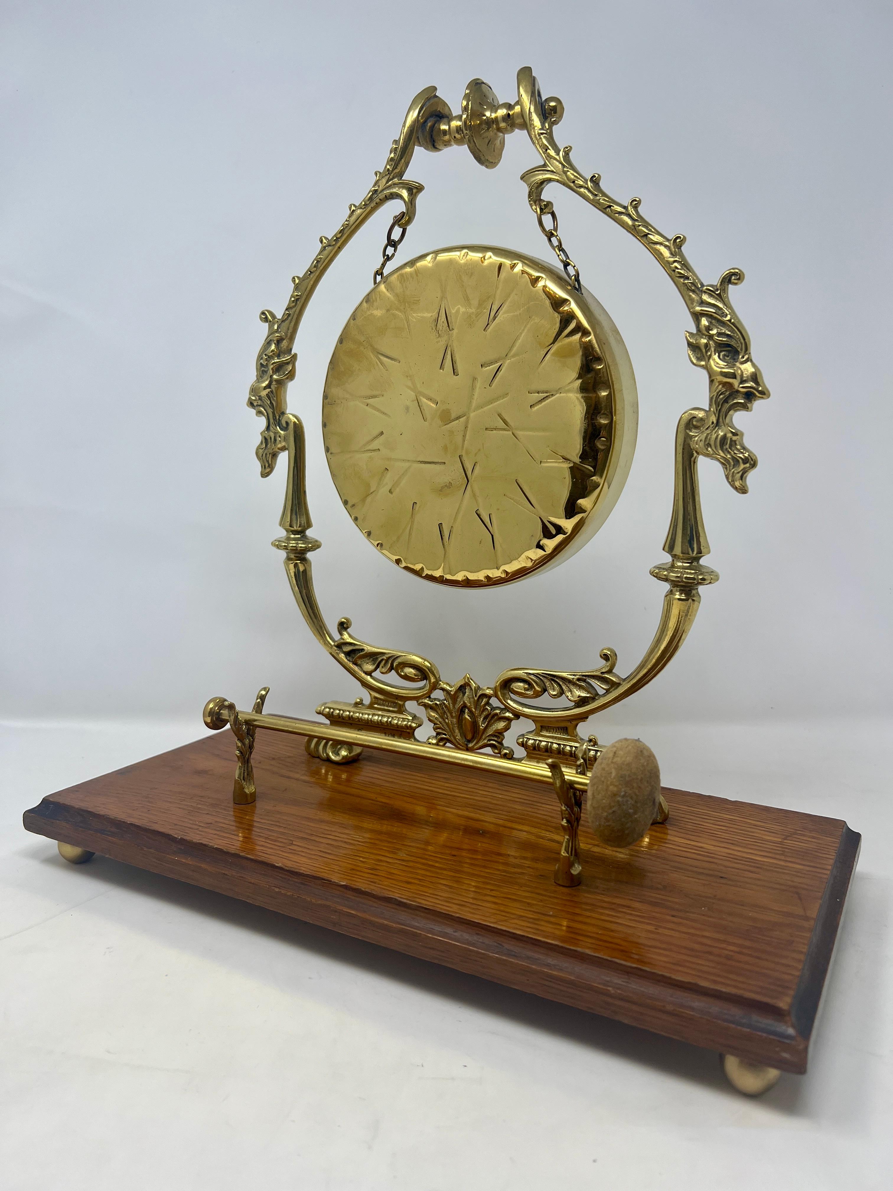 Antique English Brass And Oak Tabletop Gong, Circa 1910.
Wonderful lines and intricate designs in brass.