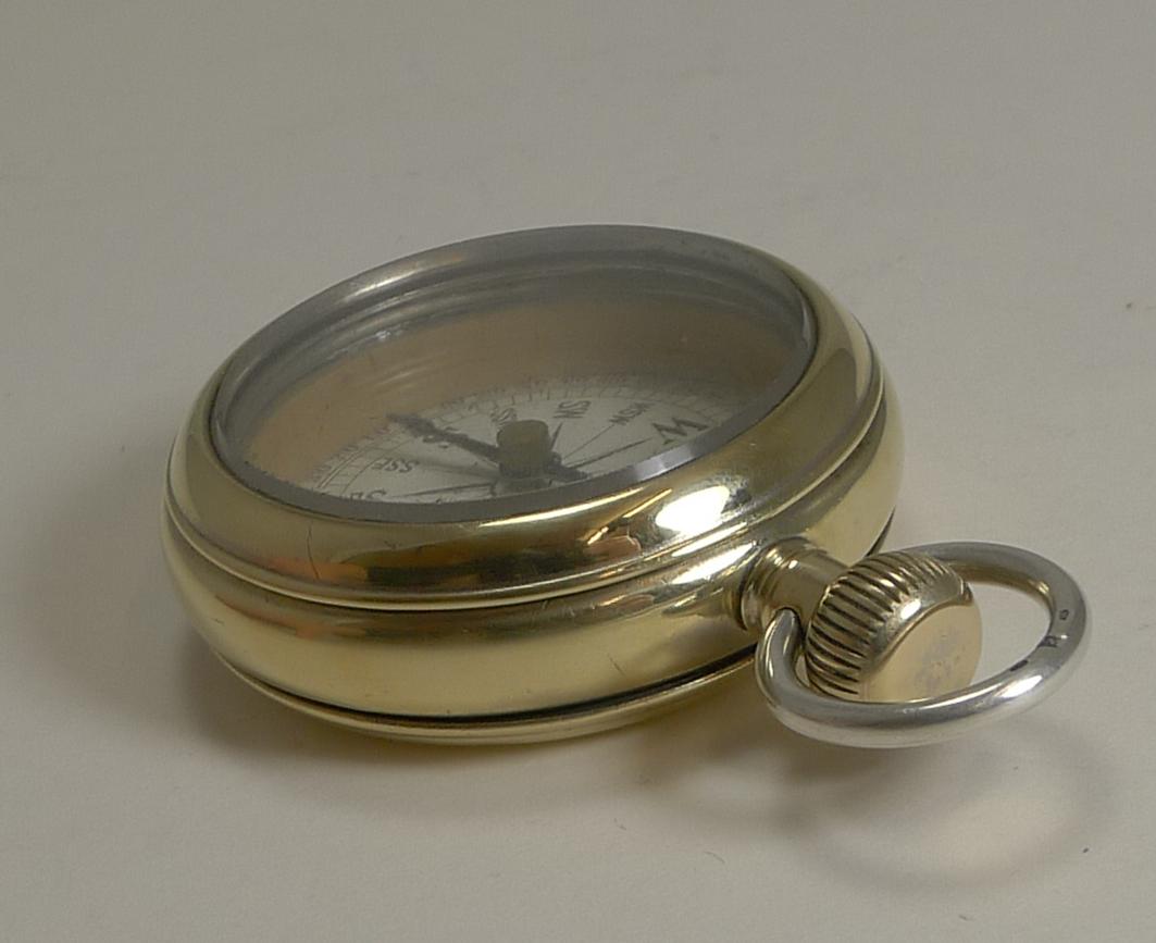 silver pocket compass