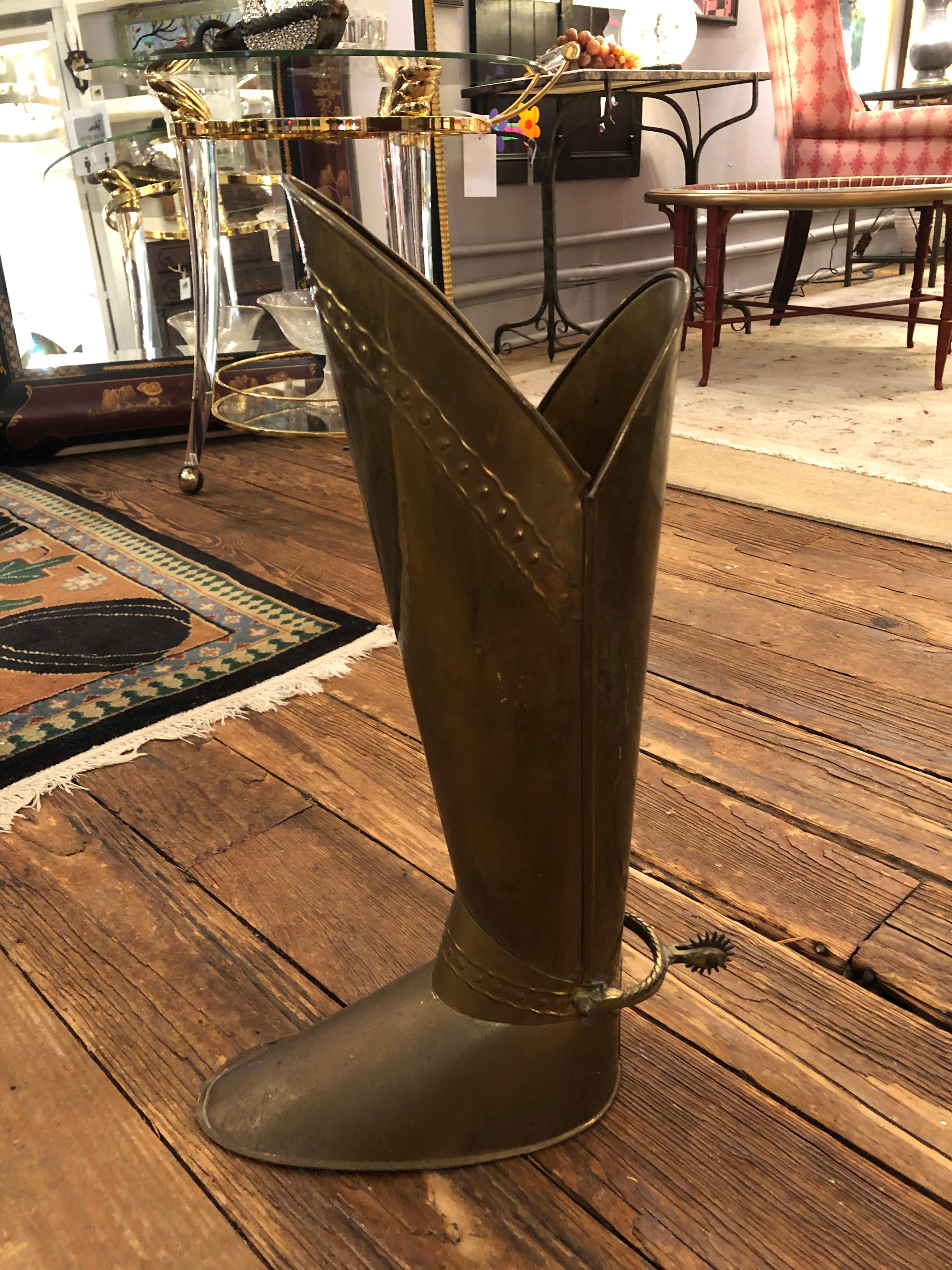 A great looking antique brass umbrella stand in the shape of a gentleman rider's boot, complete with spur.