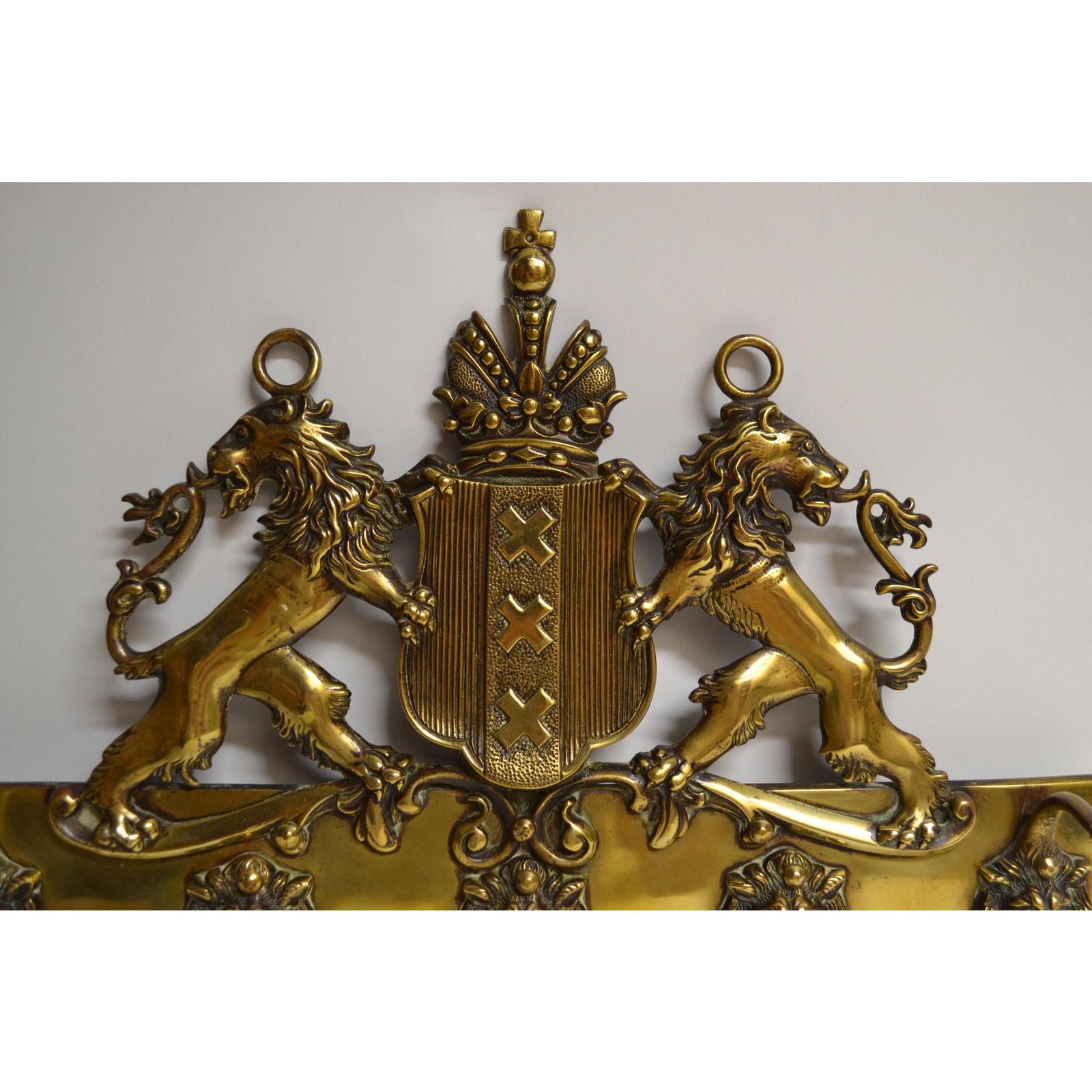 brass coat of arms