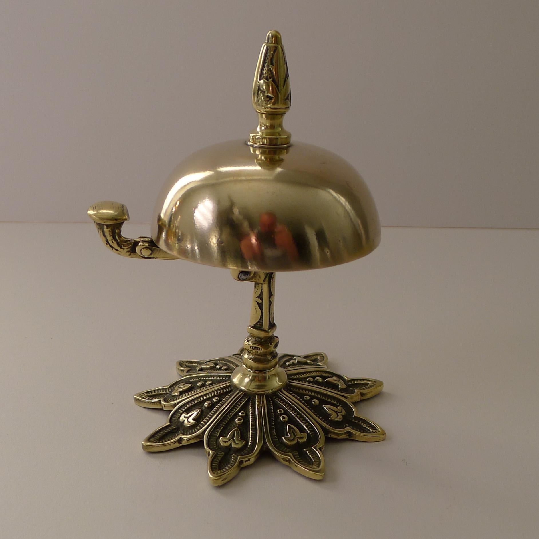 A wonderful and highly decorative desk or counter bell, my 
favourite kind with the more unusual clapper to the side rather than the ones you ring from the top. The hinged clapper is released and gives a clear and authoritative ring.

A true
