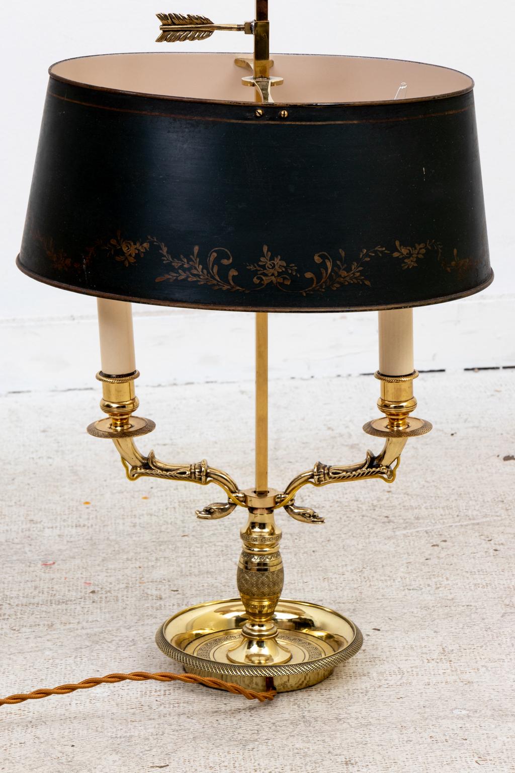 Circa 1890s antique English Regency style brass and green tole bouillotte lamp, newly shined and lacquered. Shades not included. Made in England. Please note of wear consistent with age.
