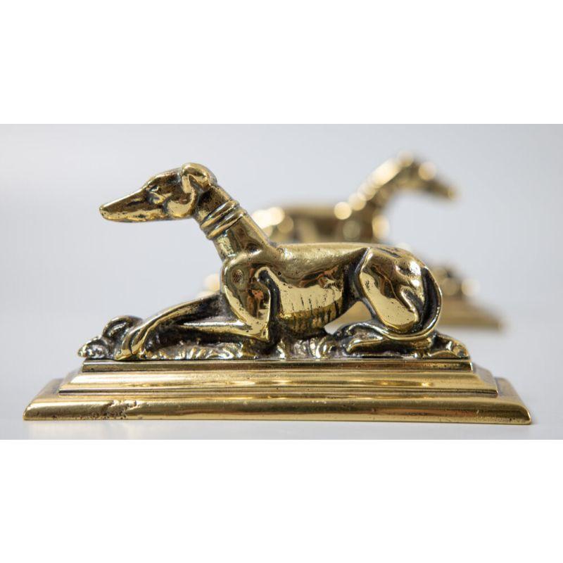 A superb pair of antique English solid brass greyhounds or whippet dogs mantel decorations or bookends, circa 1900. These handsome dogs are solid and heavy with fine details, and would look fabulous displayed on a bookcase or mantel.

 