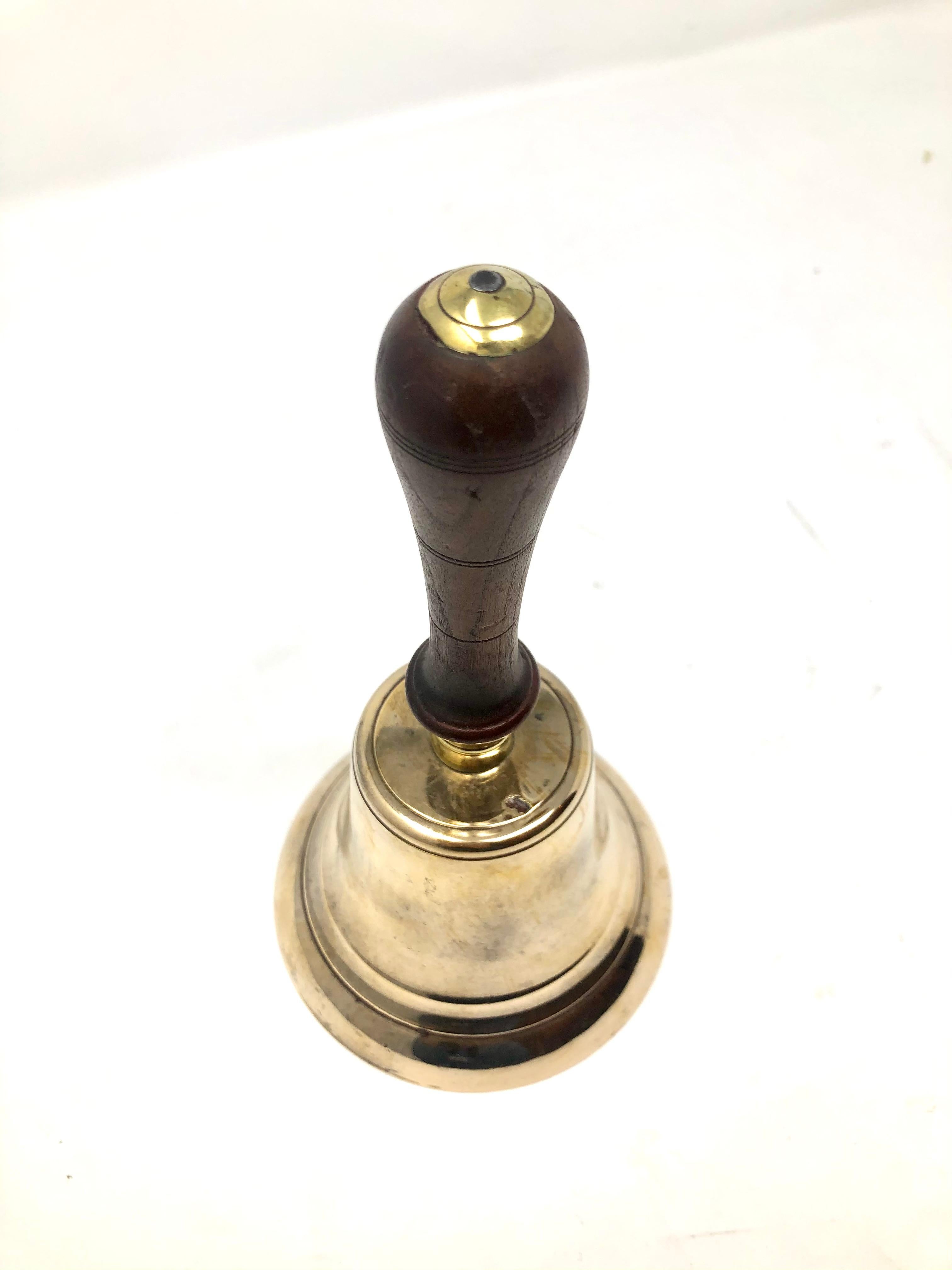 Antique English brass hand bell mahogany handle, Circa 1900.