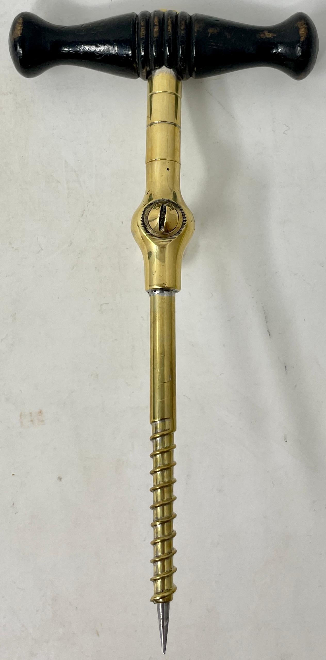 Antique English brass & mahogany champagne tap, two-piece design with removal trocar, Circa 1900.