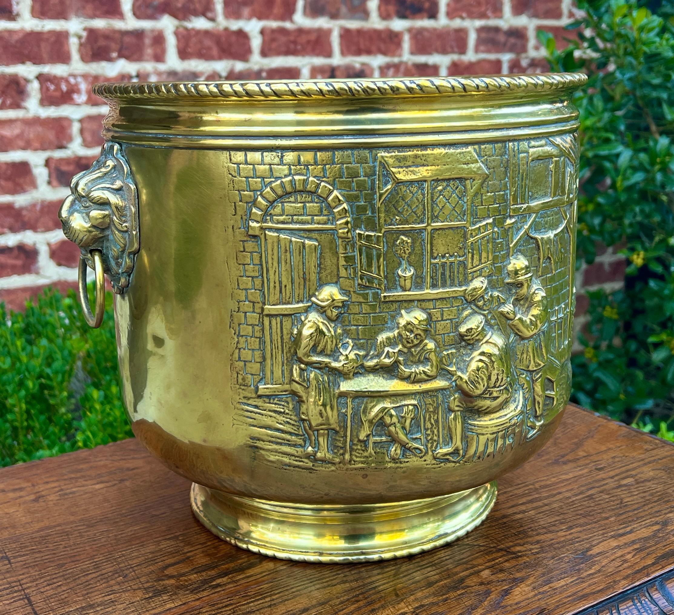 EXCELLENT Antique English Brass Planter Flower Pot Jardiniere with Lions Heads and Pub Scene~~c. 1930

Beautiful decorative brass planter~~excellent repousse' depicting pub scenes with lions' heads and side ring handles


        11.5