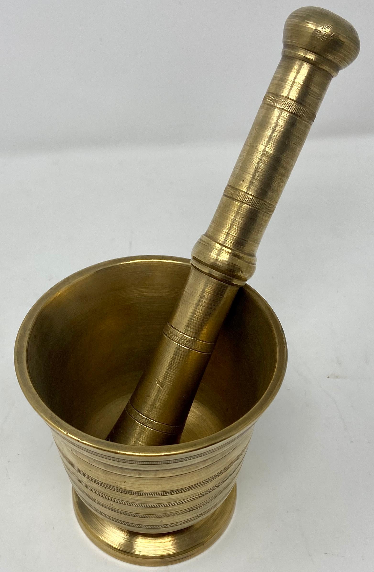 Antique English bronze mortar and pestle, Circa 1880-1890. 
Used in both household kitchens and apothecaries / pharmacies for centuries.
