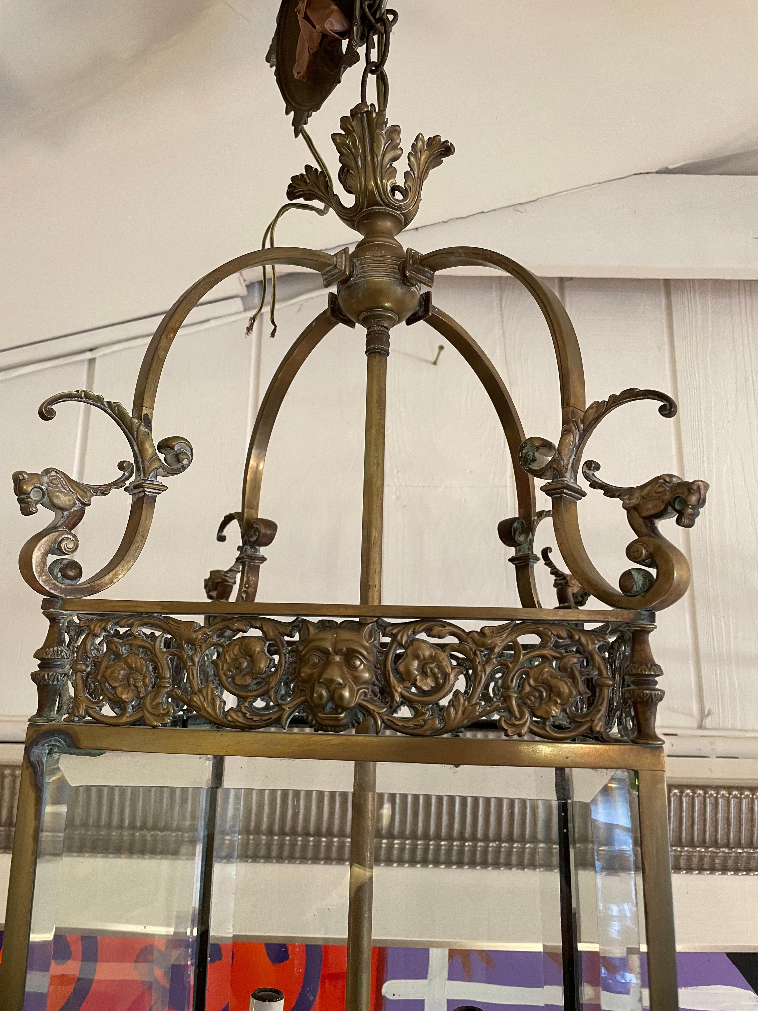 Magnificent English bronze and bevelled glass lantern having wonderful details such as lion heads and griffins.  6
