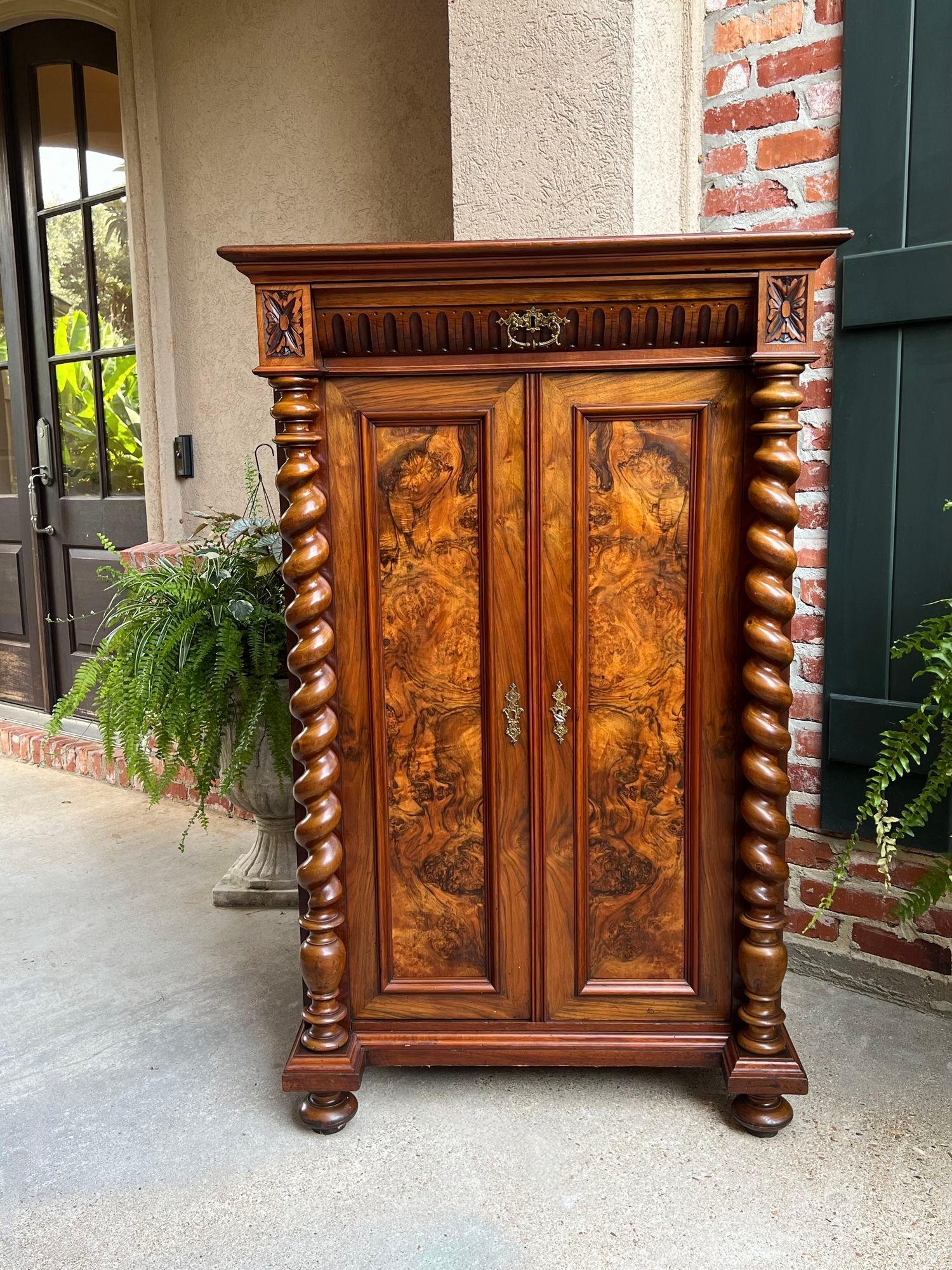Antique English Cabinet Bookcase Barley Twist Carved Burl Walnut.
Direct from England, a stunning British cabinet, tall and slender, perfect size for any room in your home, with superb burl walnut door panels!!
Upper cabinet has carved corners and a