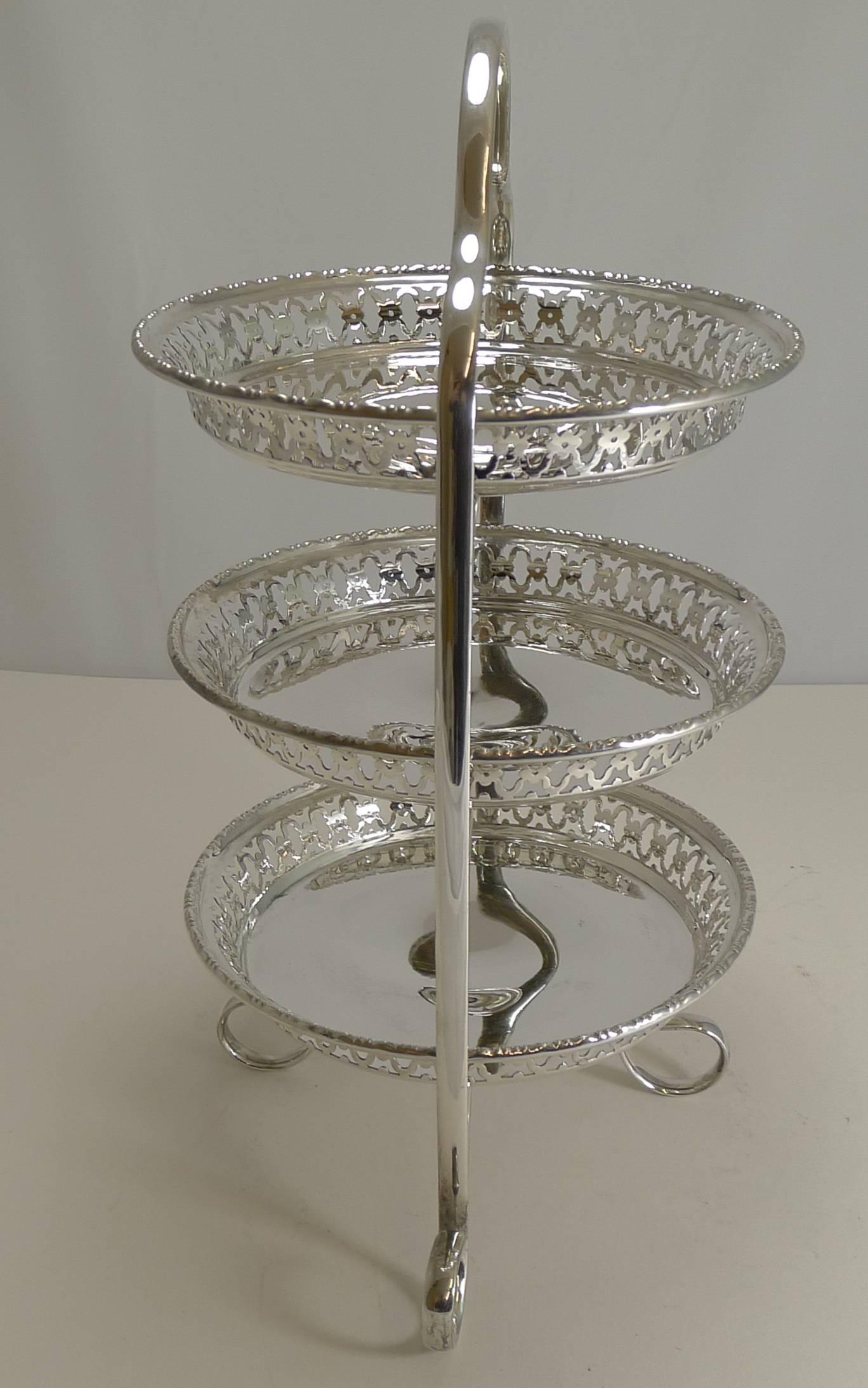 One of the most lovely cake stands I have had in some time, this three-tier example made from English silver plate. The three circular dishes are quite magnificent, each with a dimple in the centre and a wonderful pierced or reticulated