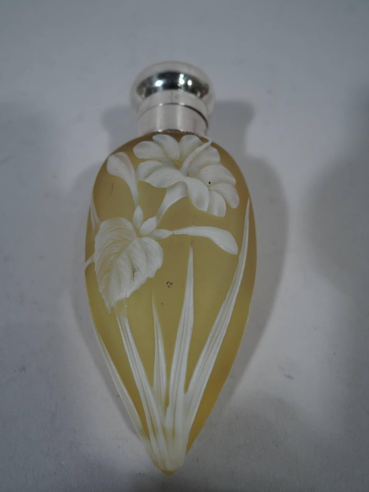 Victorian cameo glass and sterling silver lemon drop perfume. Made by Thomas Wilkinson & Sons in Birmingham in 1896. Glass vial with raised white flowers on soft yellow ground. Short sterling collar and cork-lined bun cover. Hallmarked.