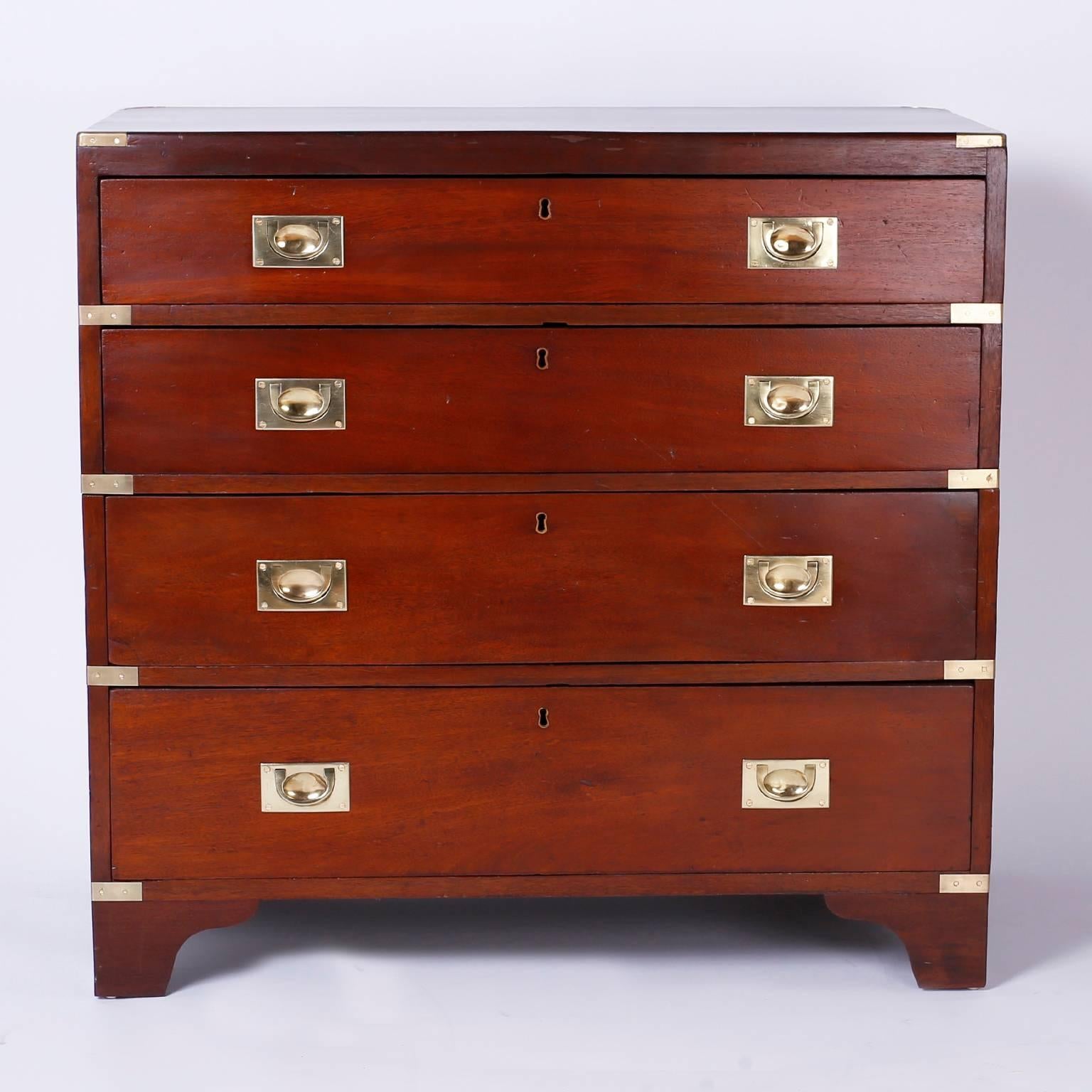 Authentic English officers Campaign chest with four drawers and
retaining its original brass hardware. Crafted in two pieces with
mahogany and set on bracket feet. Battle tested and reinvigorated for
the next centuries.