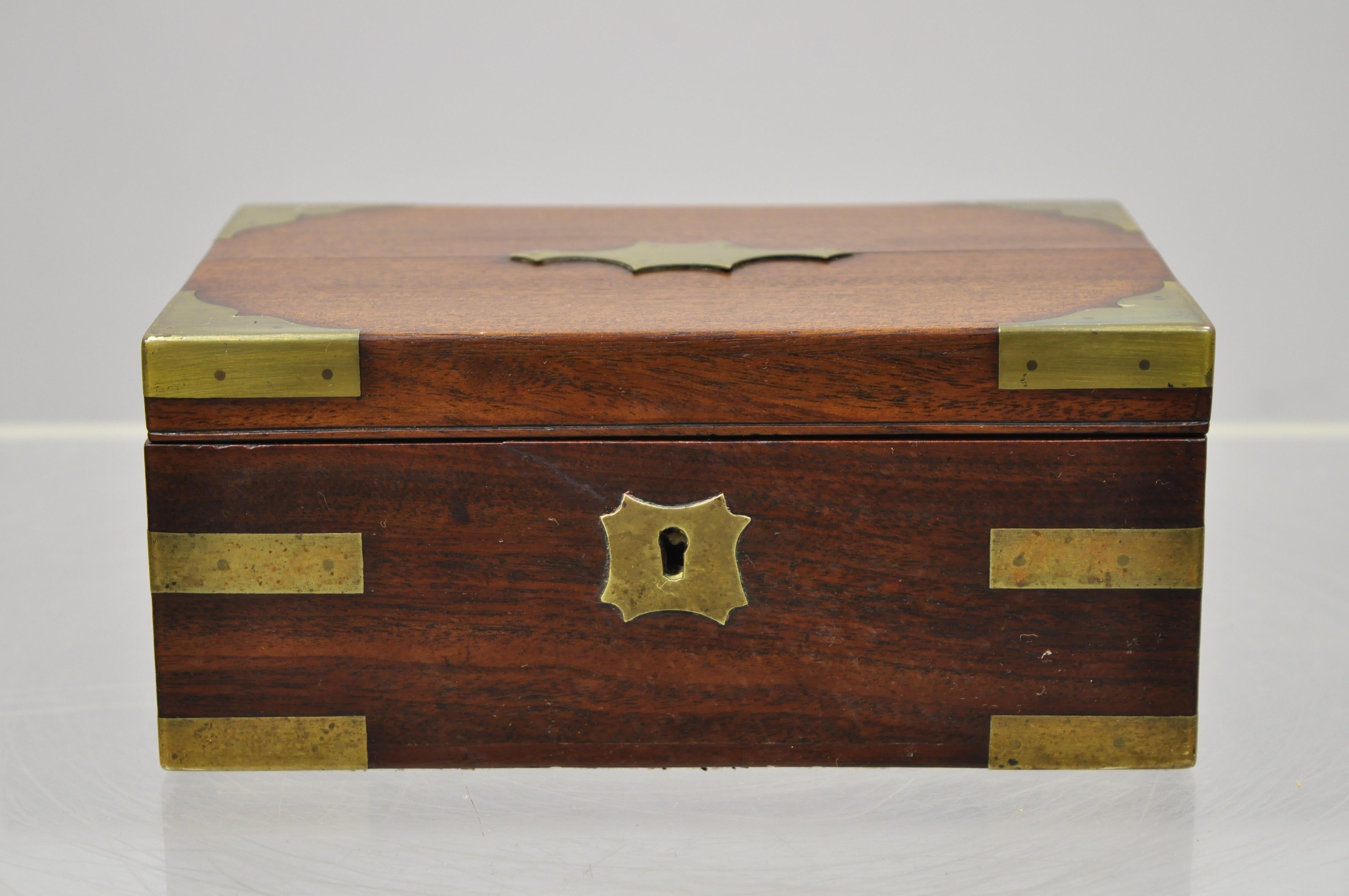 Antique English Campaign style mahogany brass military writing jewelry desk box. Item includes a lift out insert, brass accents, no key, but unlocked, very nice antique item, circa late 19th century. Measurements: 3.5