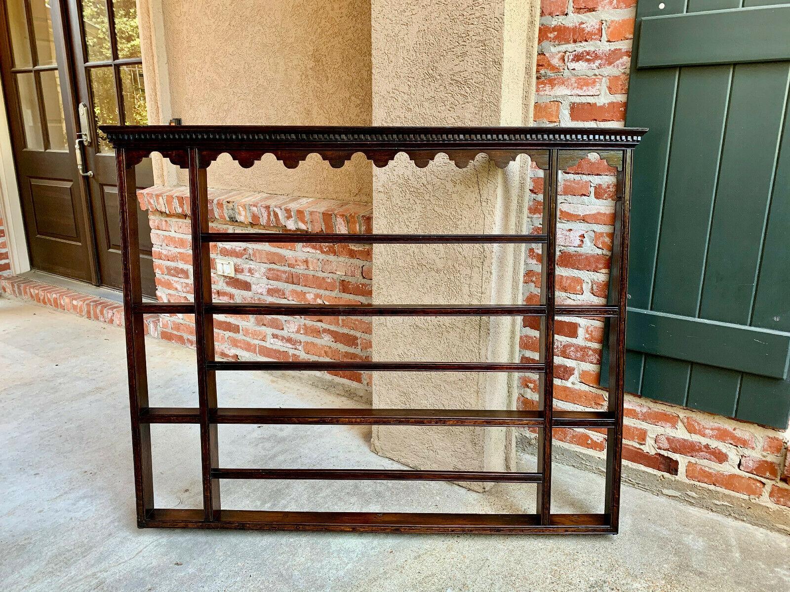 ~Direct from England~
~Large size, true antique English plate rack with so many different size display shelves!~
~Large crown, featuring dentil molding across the entire crown and arched scalloped tops on the upper cubbyholes~
~All shelves having