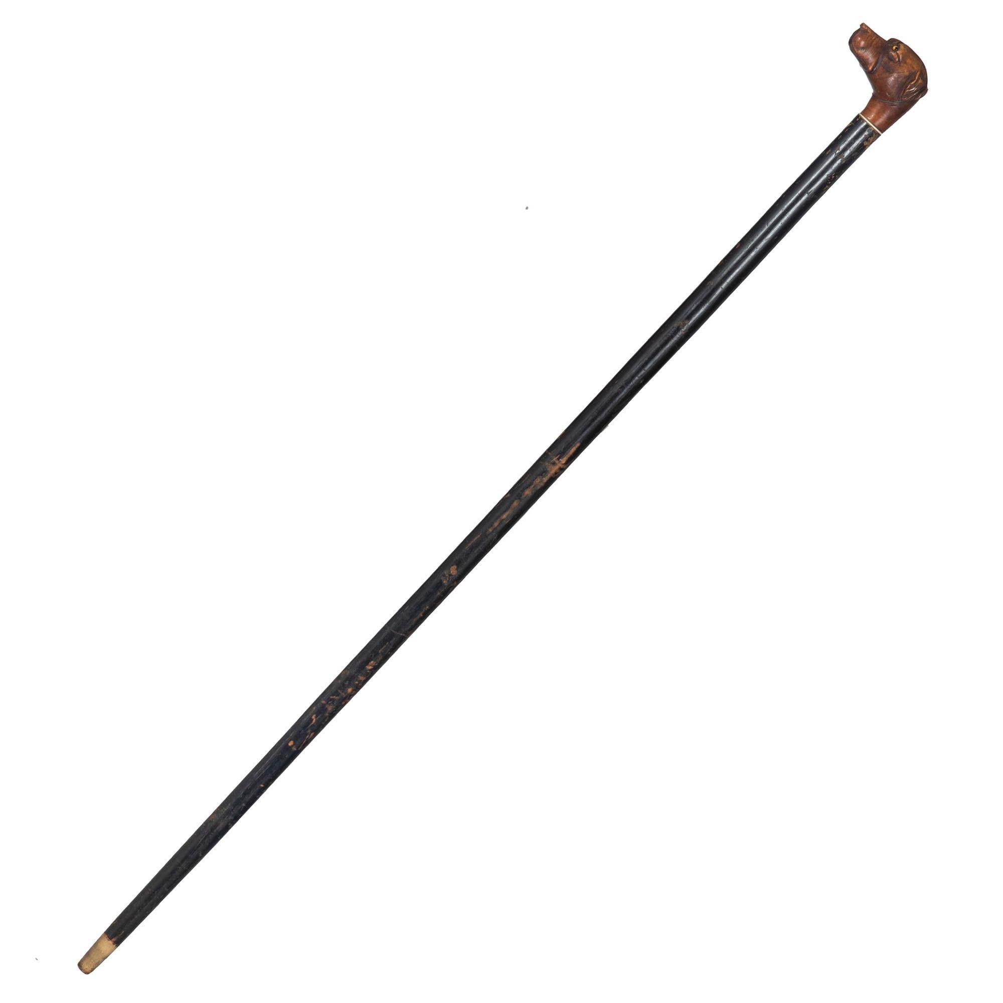 BASTONE CON TESTA DI CANE INTAGLIATA IN ARTE POPOLARE E FUSTO EBANIZZATO

Probabilmente è inglese, circa alla fine del XIX secolo.

37 1/4: H. x 2 7/8