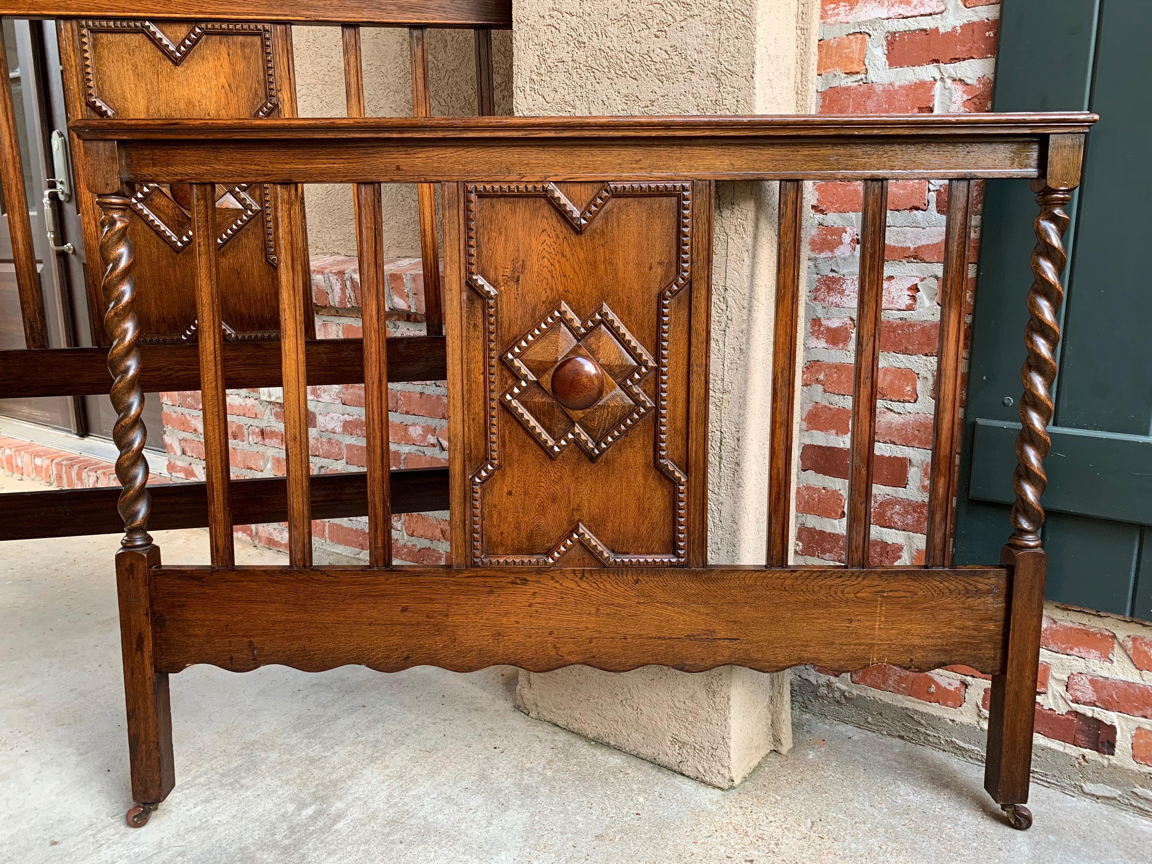 Direct from England, a beautiful antique English oak Barley Twist bed…headboard and footboard!!~
~Jacobean/Arts & Crafts styling, with barley twist posts on either side of vertical slats with a large center panel having raised carved geometric