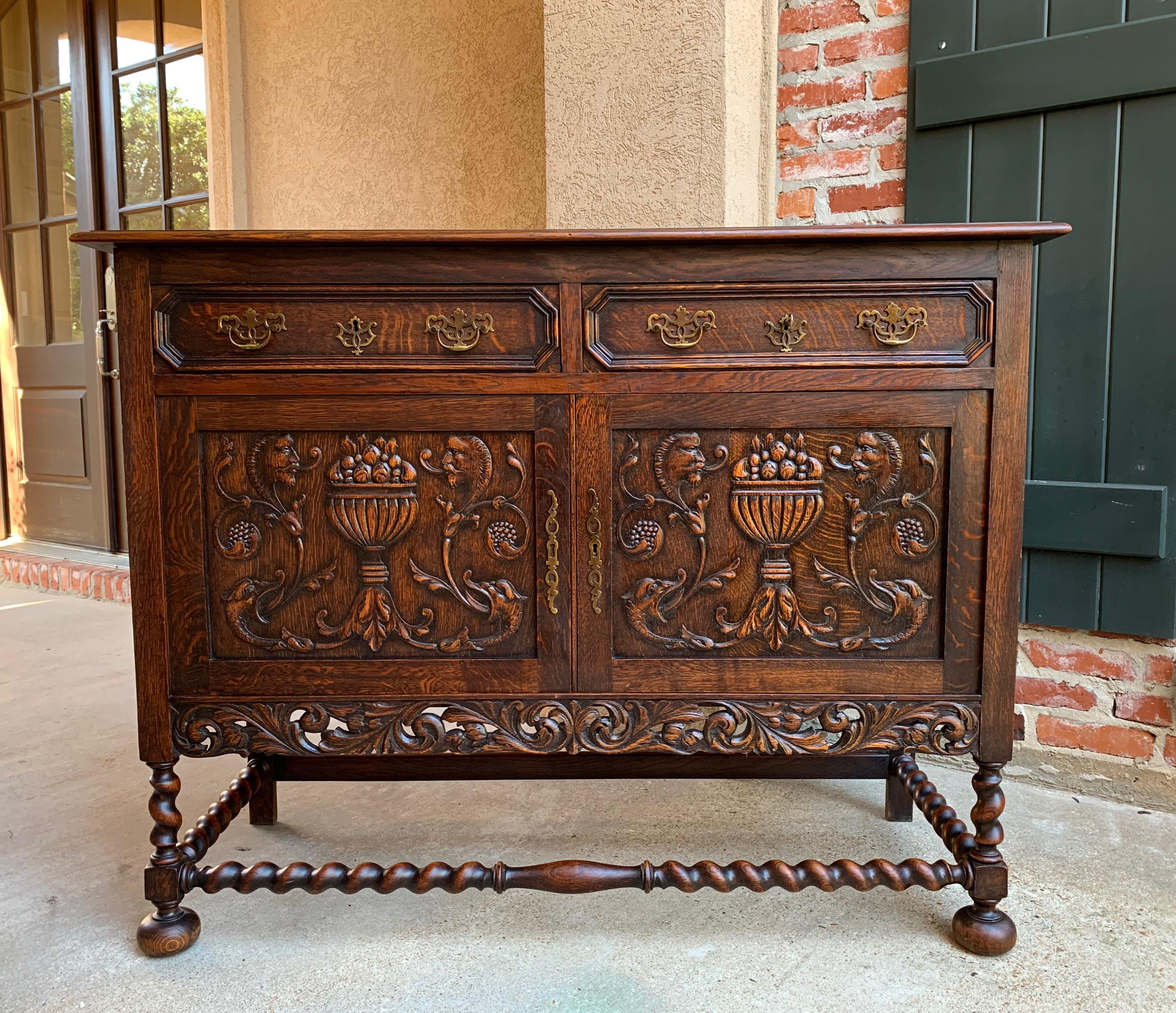 Direct from England, an outstanding antique English sideboard or cabinet, with beautiful features throughout!~
~Two large drawers have recessed octagon fronts and original brass hardware~
~Two doors feature beautiful center urns of fruits