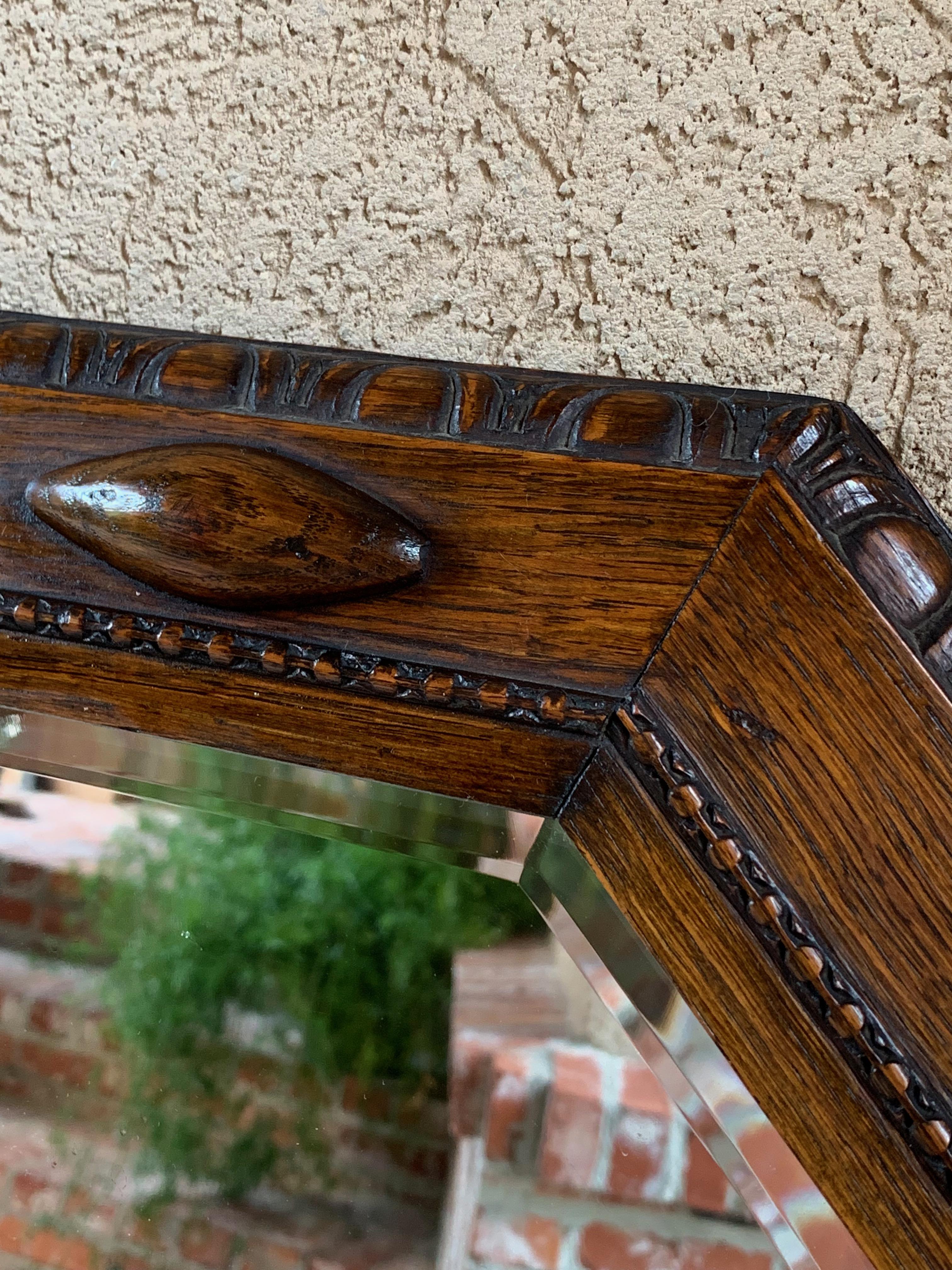 20th Century English Carved Oak Beveled Wall Mirror Beaded Jacobean Octagon, circa 1920