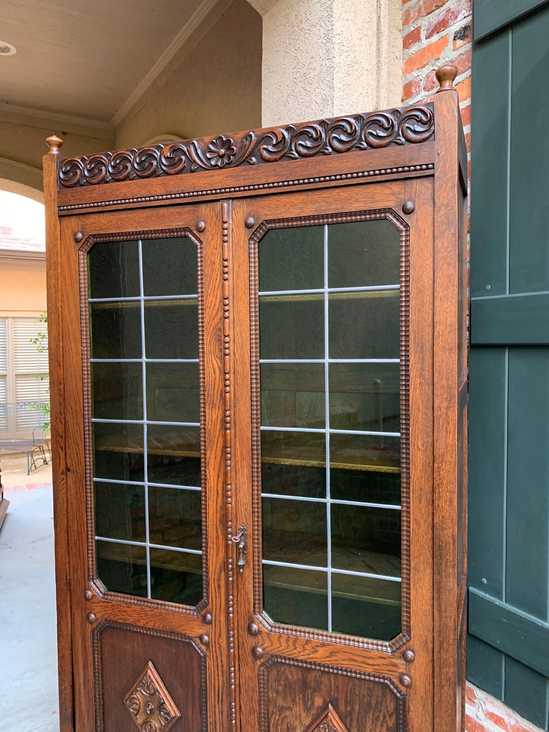 Arts and Crafts English Carved Oak Bookcase Green Leaded Glass Jacobean Style, 20th Century