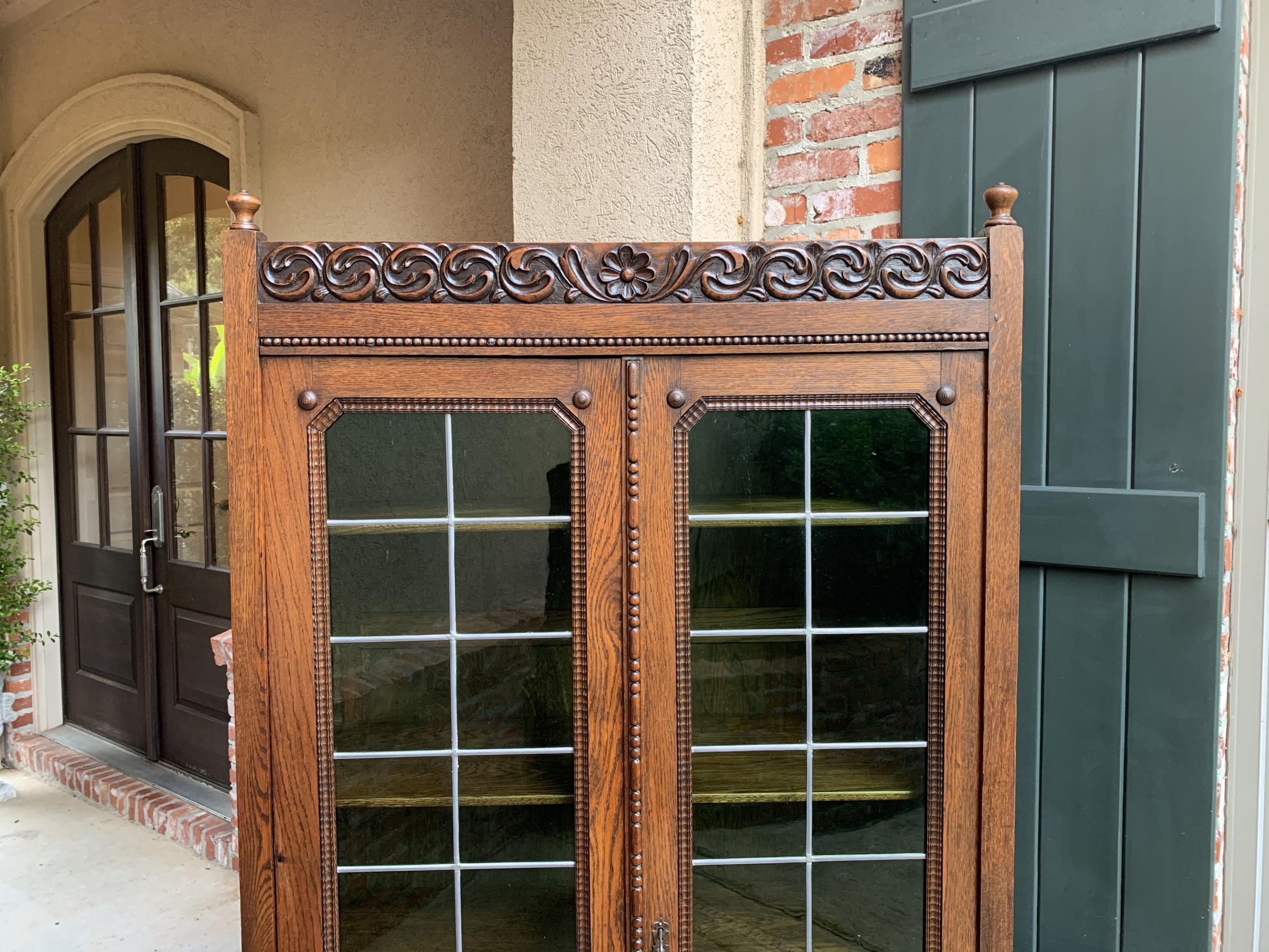 British English Carved Oak Bookcase Green Leaded Glass Jacobean Style, 20th Century