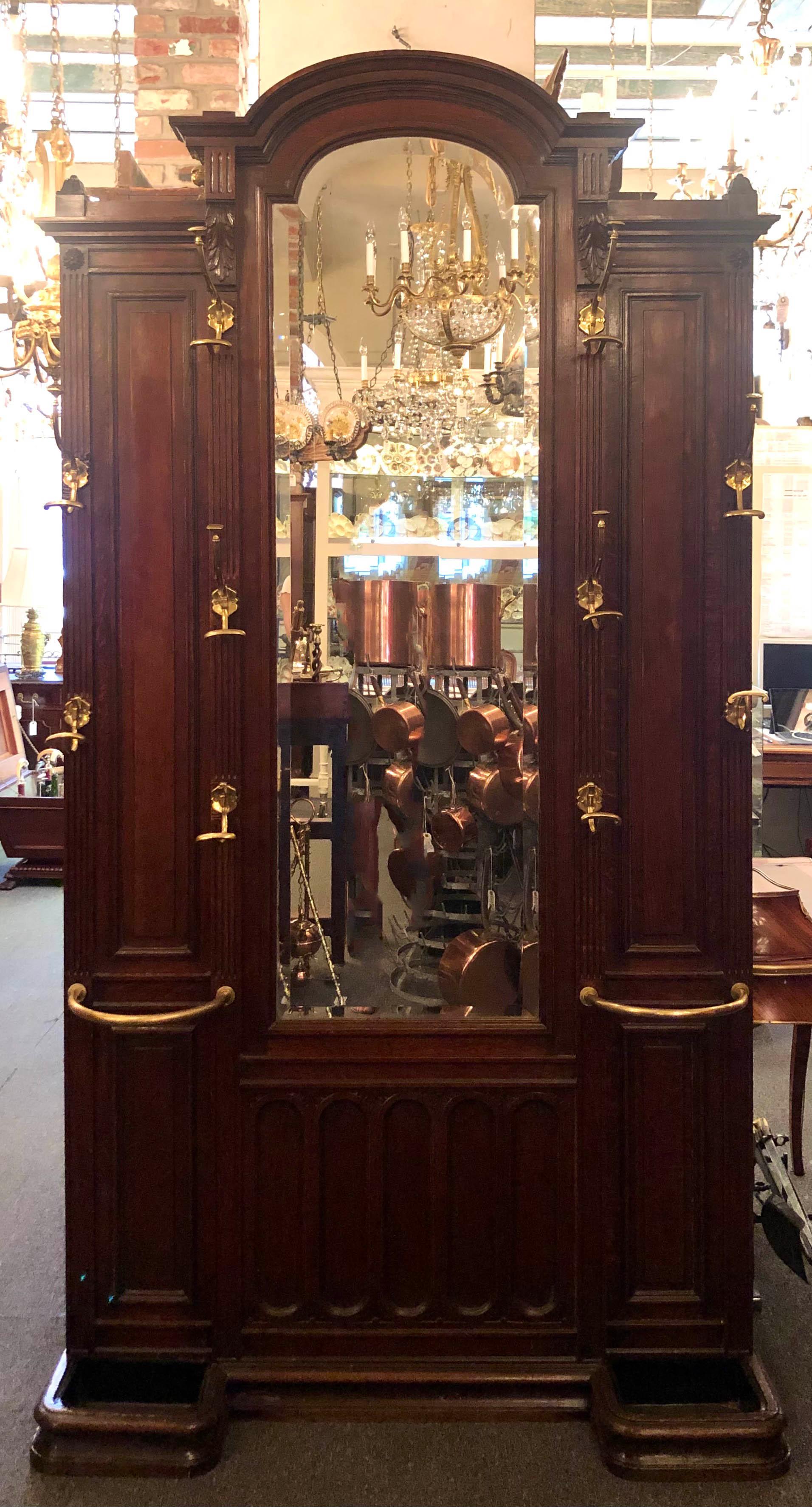 Antique English carved oak & brass coat rack umbrella stand with beveled mirror.