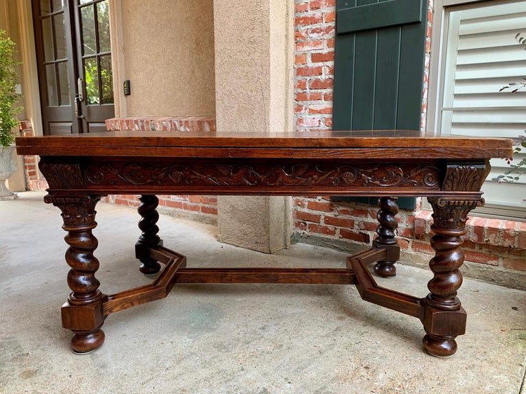 ~Direct from England~
~A huge antique English oak “draw leaf” table, over nine ft. length when fully opened, that’s one of the largest antique table we’ve found!~
~Massive barley twist legs, with thick shaped stretchers and center cross-stretcher
