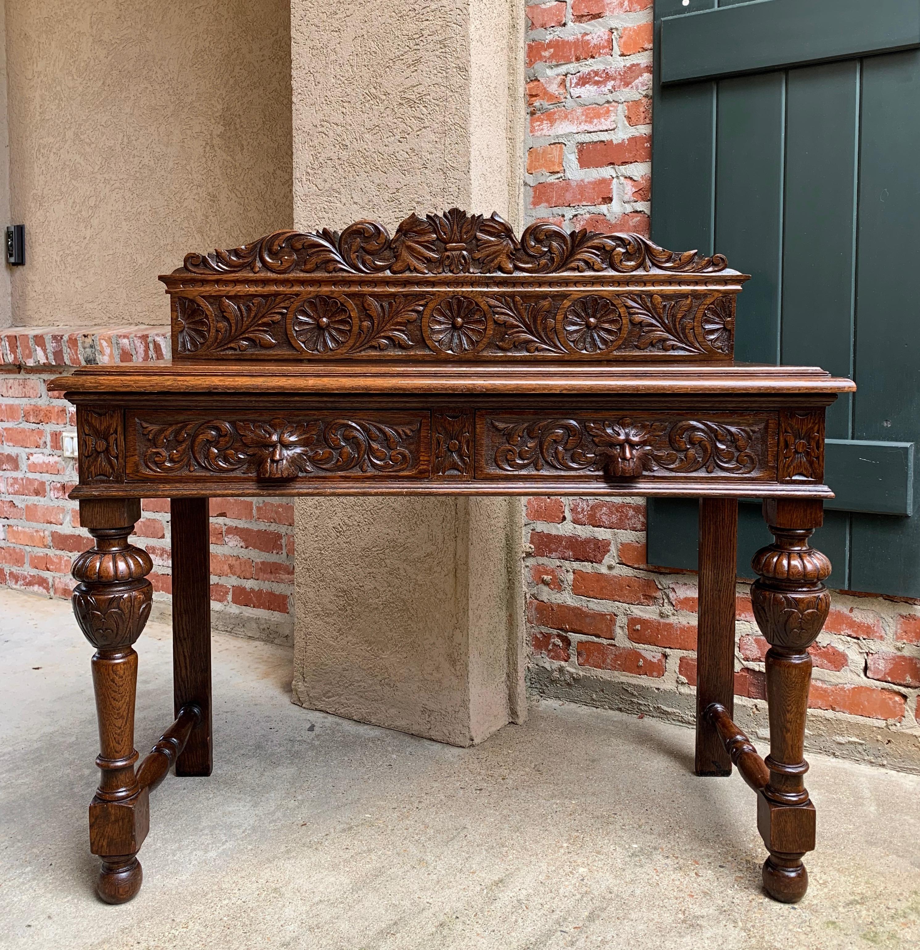Direct from England, a perfect size antique English oak sofa or hall table~
~Carved lion’s mask on the back high crown~
~Renaissance hand carved lion mask handles on both drawers~
~Venerable English style with ornate bulbous carved oak