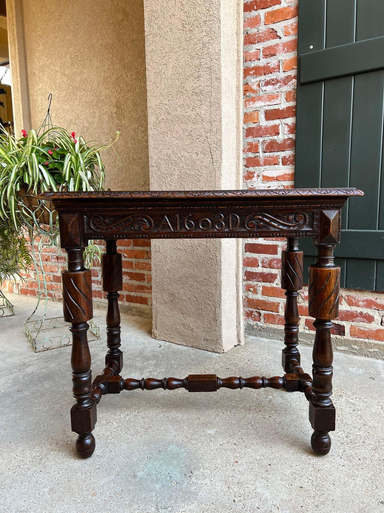 Antique English carved oak hall sofa table British Tudor c1900.

 Direct from England, a very highly carved and elegant antique English hall table in a perfect size for anywhere from your foyer to sofa to bedside!
A striking silhouette, defined