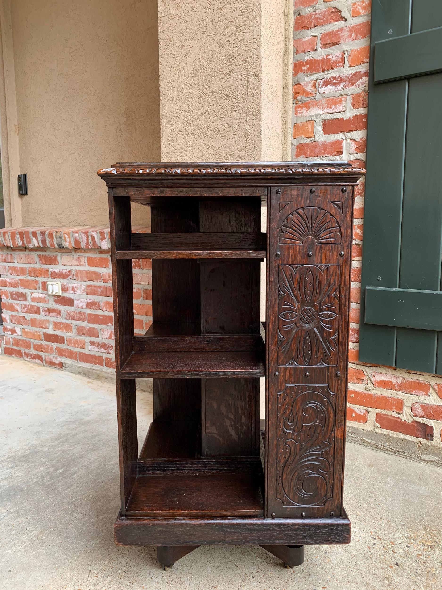 Antique English carved oak revolving rolling bookcase bookshelf office library

~Direct from England~
Classic British style in this antique English oak revolving bookcase that both rolls and revolves. Wide carved band and carved beveled edge to the