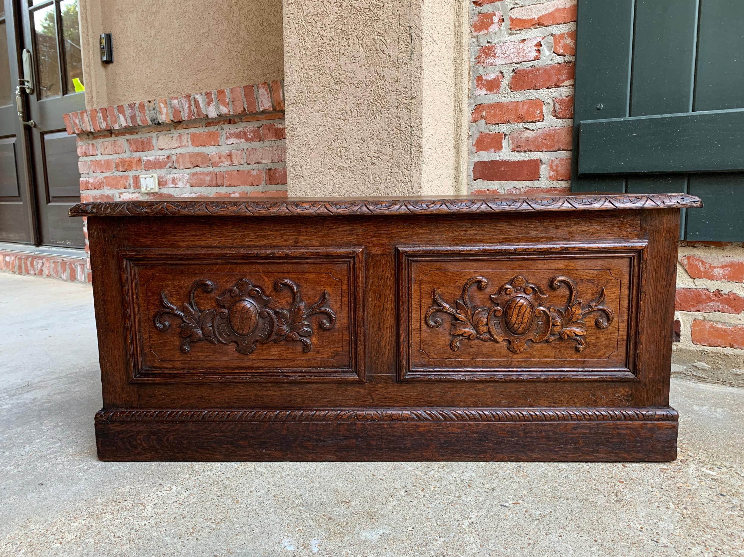Antique English carved oak trunk chest coffee table blanket box

~Direct from England~
~Great size antique English carved oak blanket box or coffee table!~
~Two inset panels with carved foliate designs around a center cartouche~
~Carved beveled