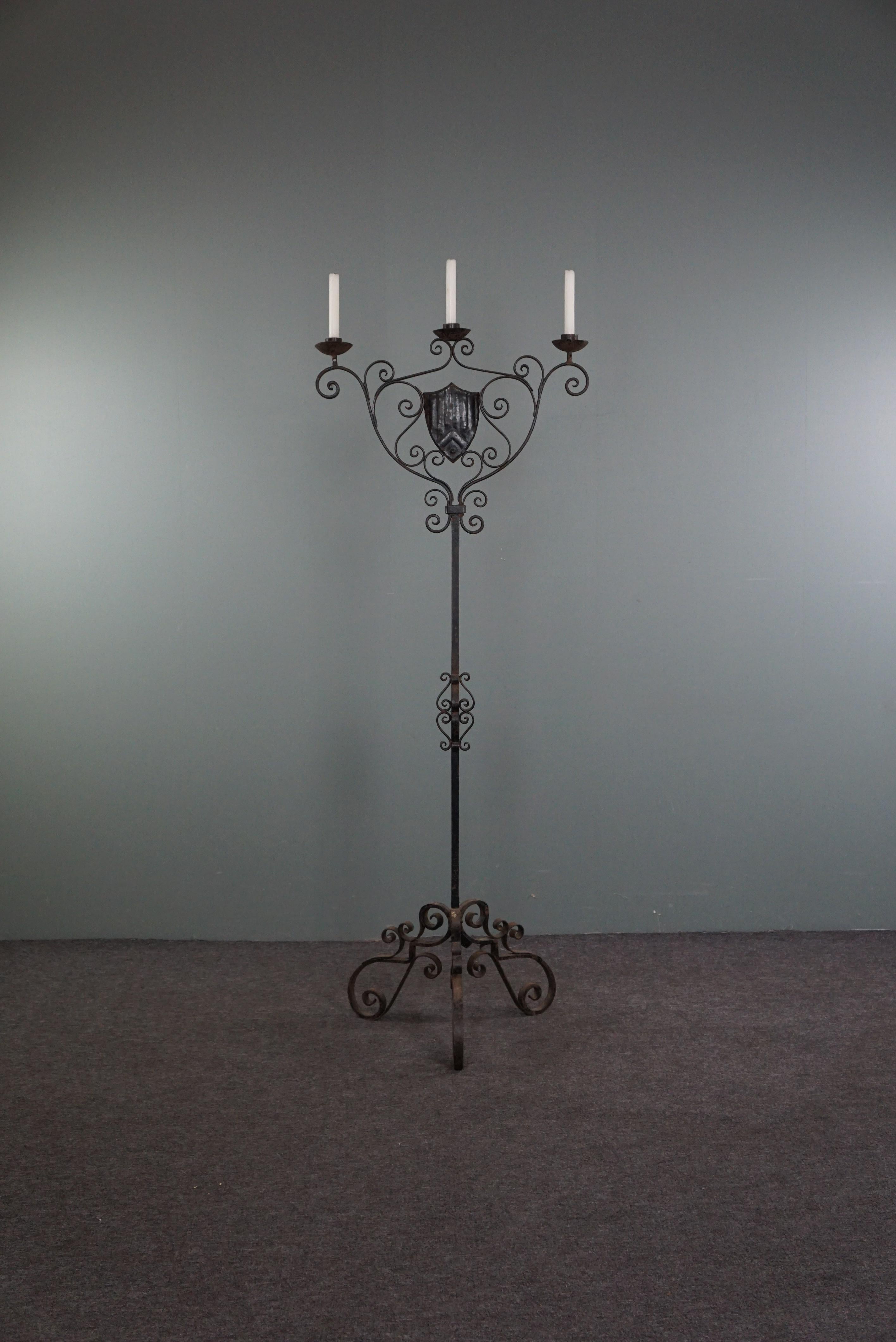 Offered is this English candlestick.
This candlestick would not look out of place in a large castle room next to a fireplace. But to create this feeling at home, you don't have to live in a castle. This candle holder is so impressive and striking in