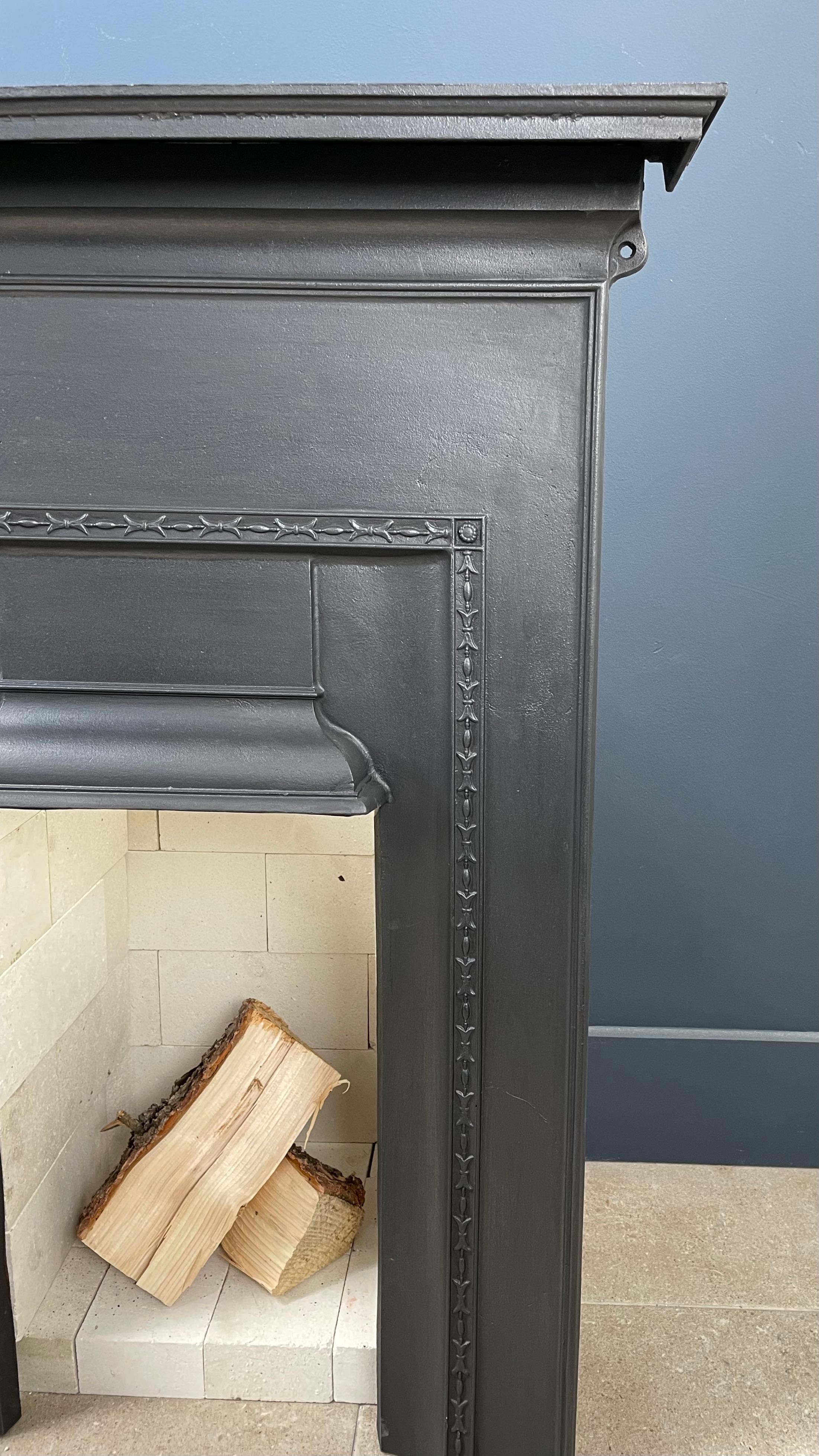 And beautiful antique English cast iron fireplace. This cast iron fireplace can be placed in front of an existing fireplace or can be placed separately. This cast iron fireplace is supplied including white refractory bricks (see photos).
  