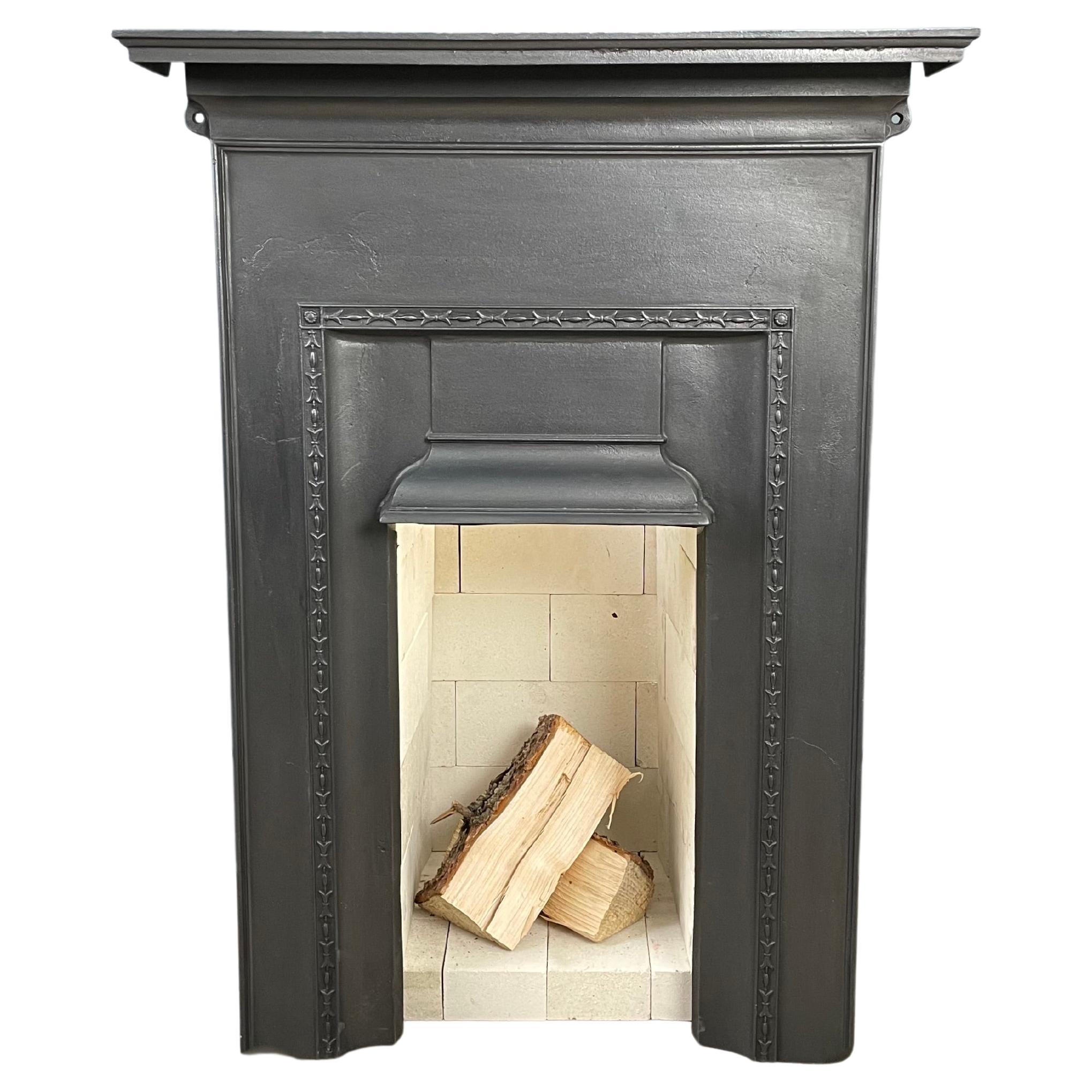 Antique English Cast Iron Fireplace Including Refractory Brick Insert For Sale