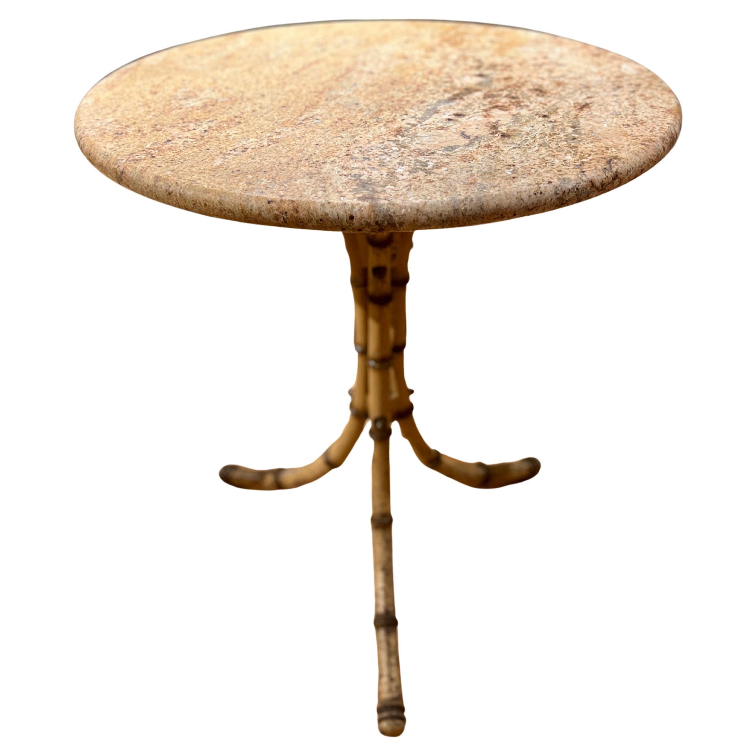 English, circa 1900.

This delightful antique English bistro or café table, dating to circa 1900, combines a beautifully veined marble top with an intricately cast iron base in a faux bamboo design. The sturdy cast iron base mimics the natural