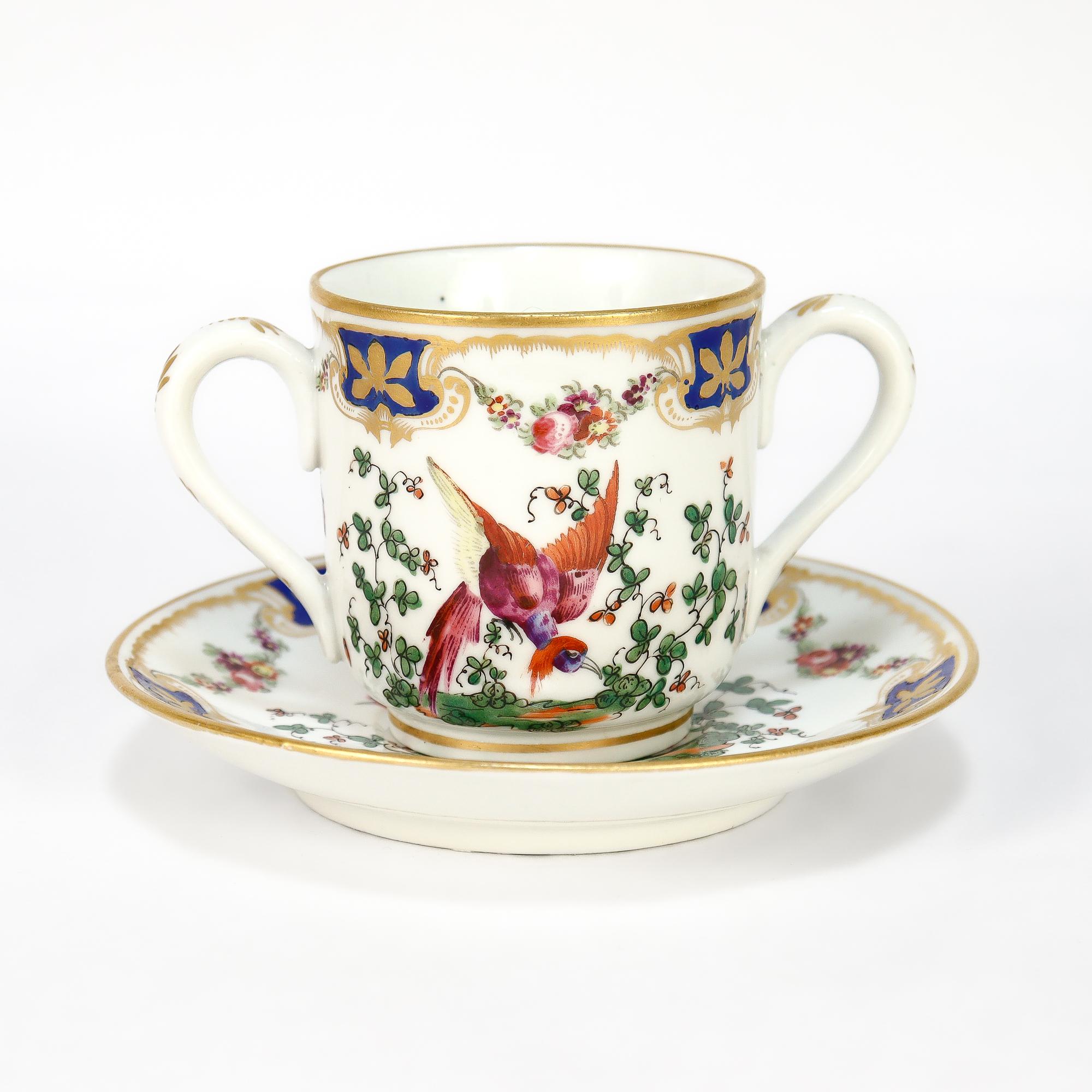 British Antique English Chelsea Style Porcelain Chocolate Cup & Saucer Birds of Paradise For Sale