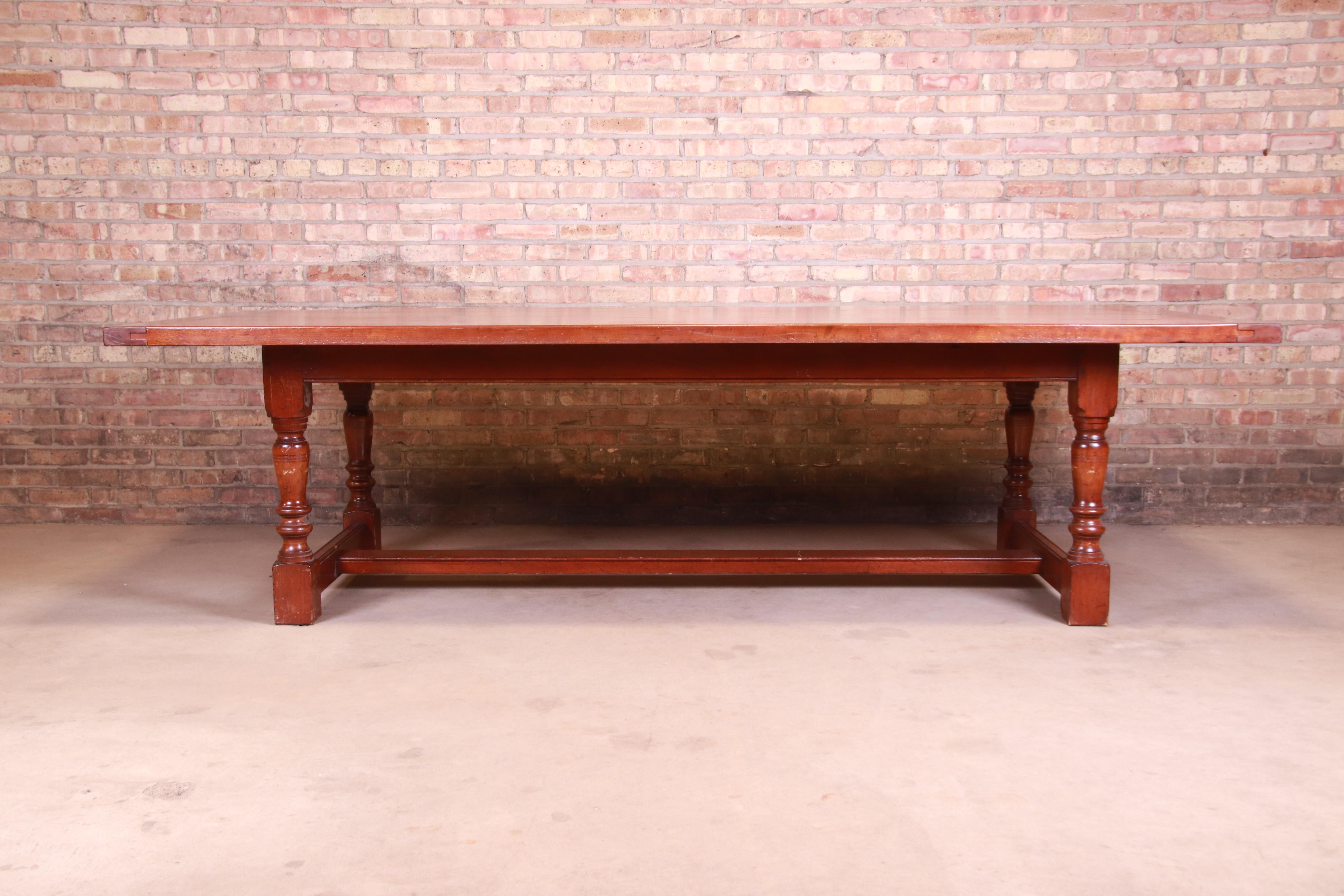 A gorgeous antique harvest farmhouse refectory dining table

England, Circa 1890

Solid cherry wood, with turned legs and trestle style base.

Measures: 107.5