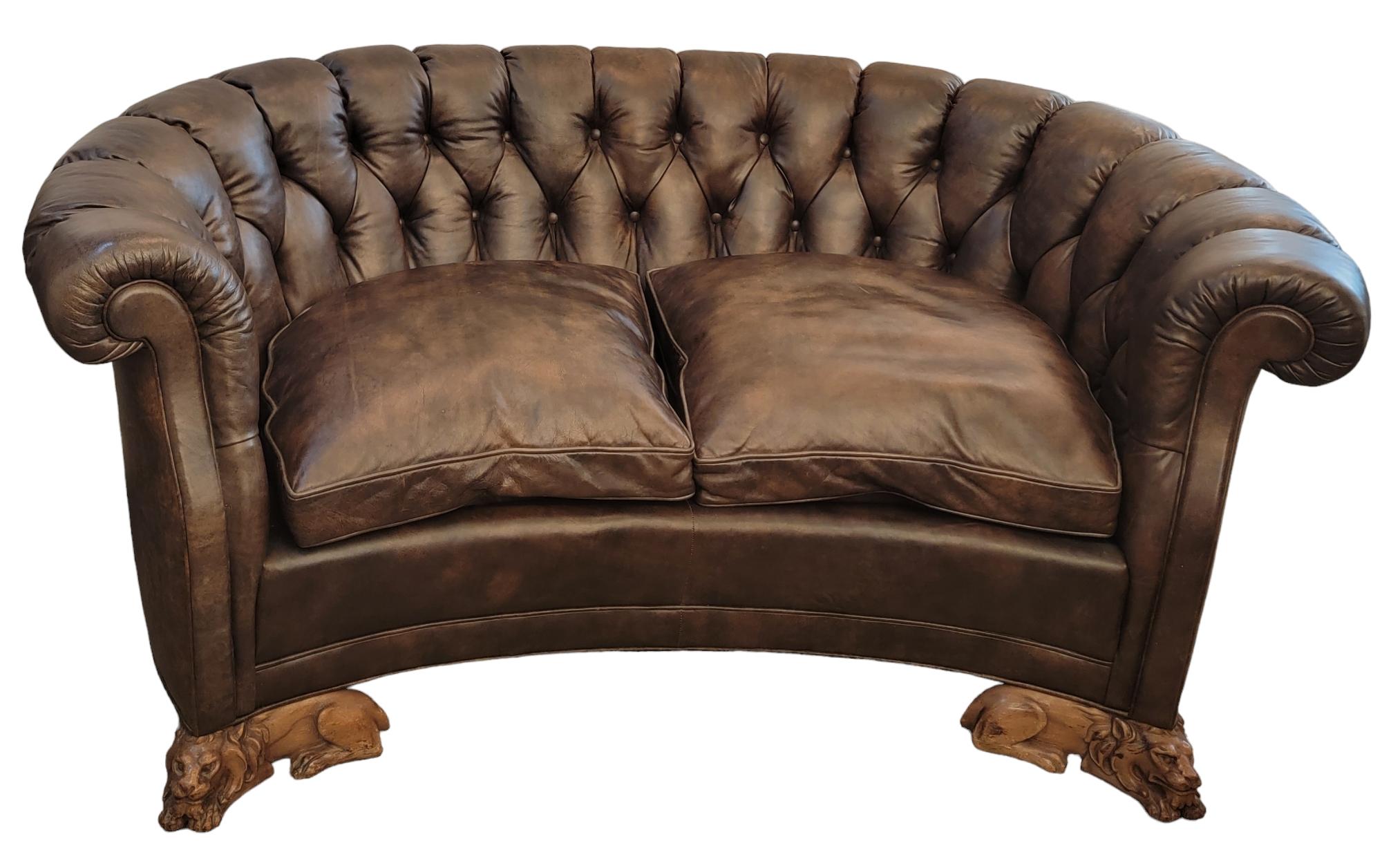 Wonderful Leather Chesterfield sofa with hand carved wooden lions legs.
English Tifted Leather Sofa With Wooden Lion Feet. The leather a beautiful varigated brown throughout the entire sofa. The back legs are solid and slightly curved. Cushioned