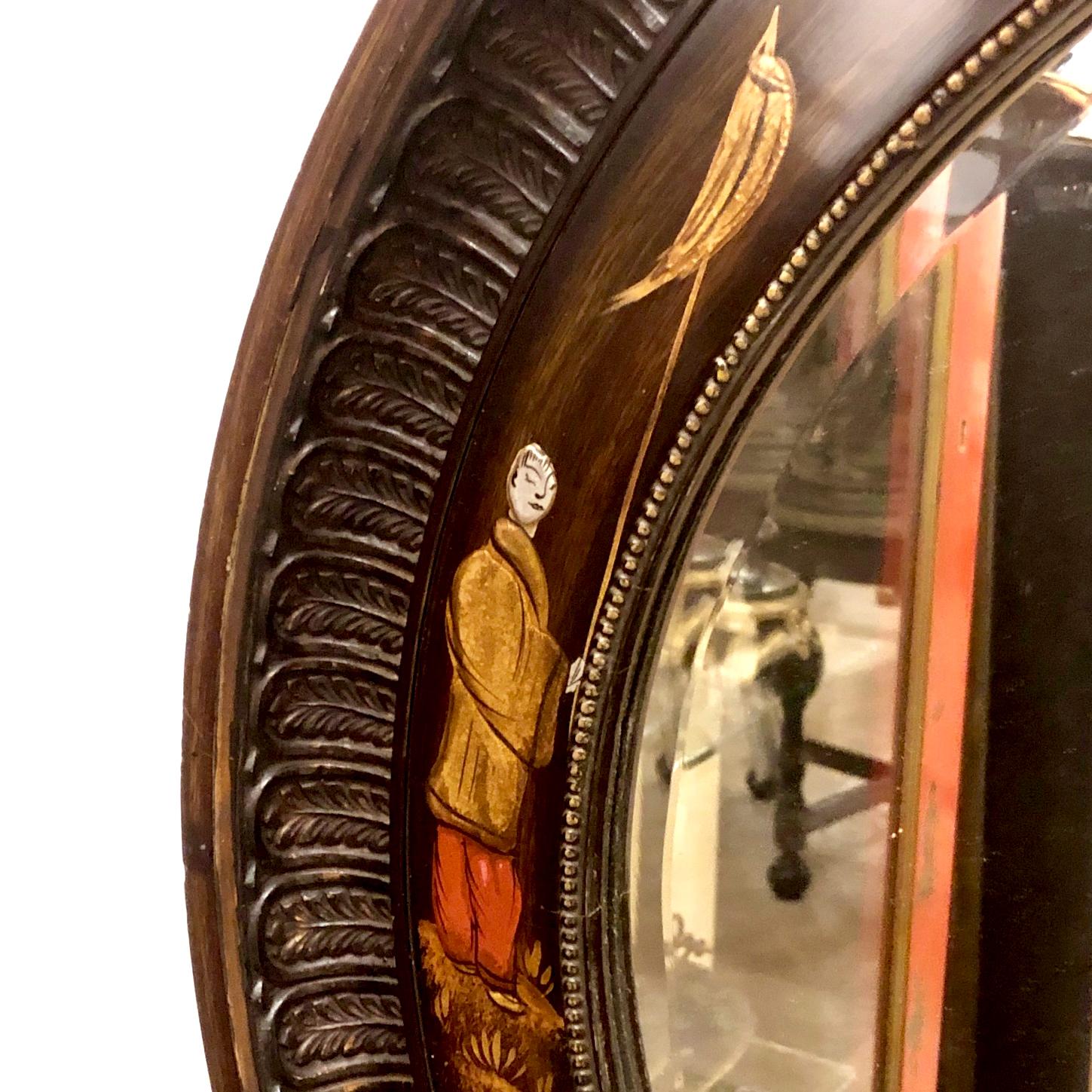 A circa 1900 English ebonized and lacquered wood mirror with hand painted chinoiserie decorations.

Measurements: 
Length 36.5