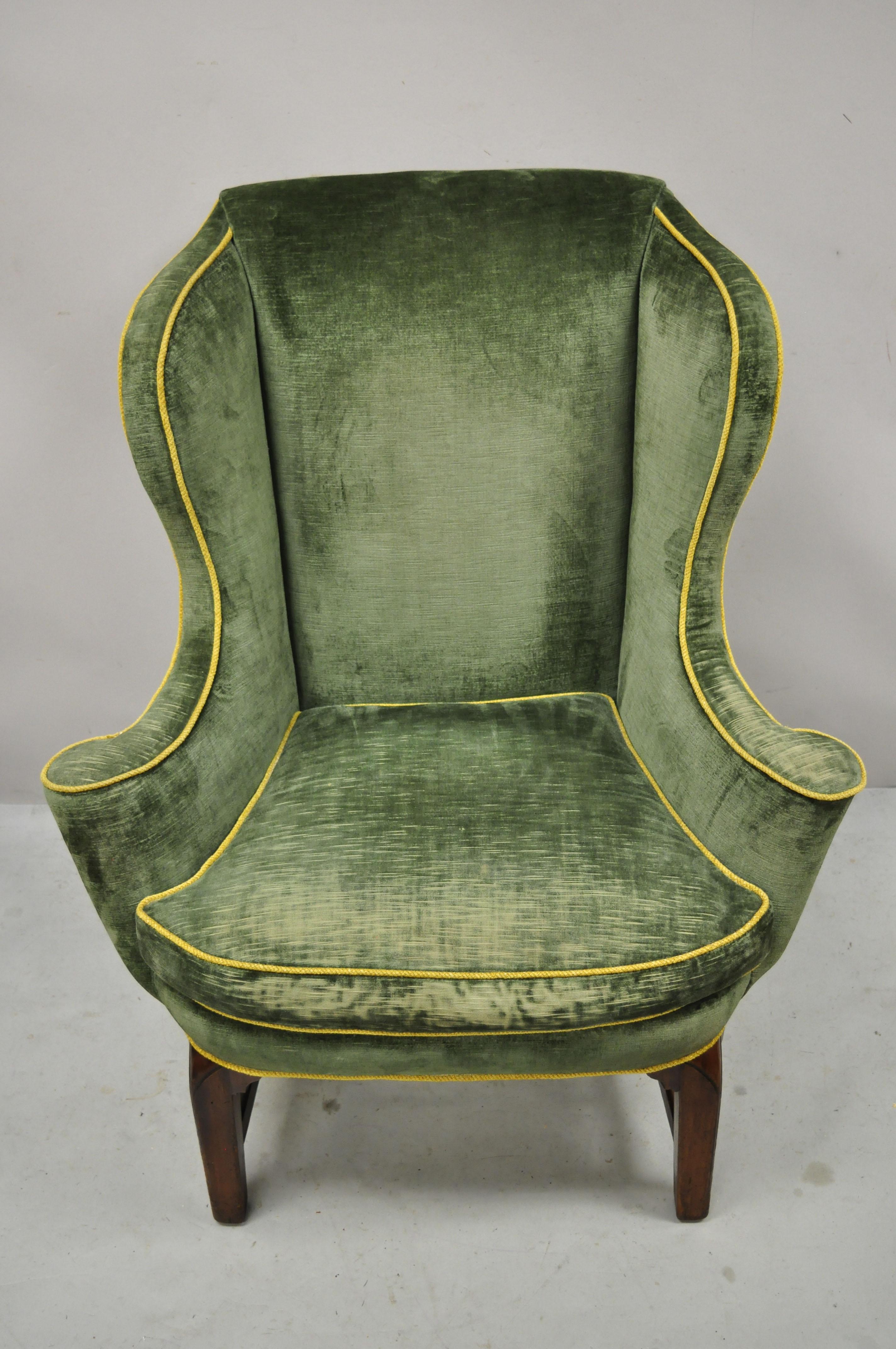 Antique English Chippendale Georgian Mahogany green mohair wingback lounge chair. Item features nice mid-size mahogany frame, green mohair fabric, stretcher base, shapely rolled arms, solid wood frame, very nice antique item, great style and form.