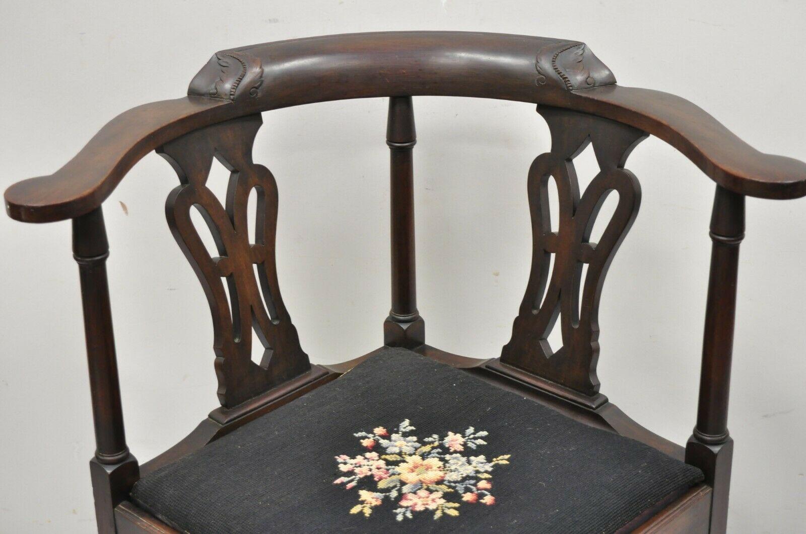 Antique English Chippendale Georgian style mahogany ball and claw corner chair. Item features a needlepoint seat, solid wood construction, nicely carved details, carved ball and claw feet, very nice antique item, quality craftsmanship, great style